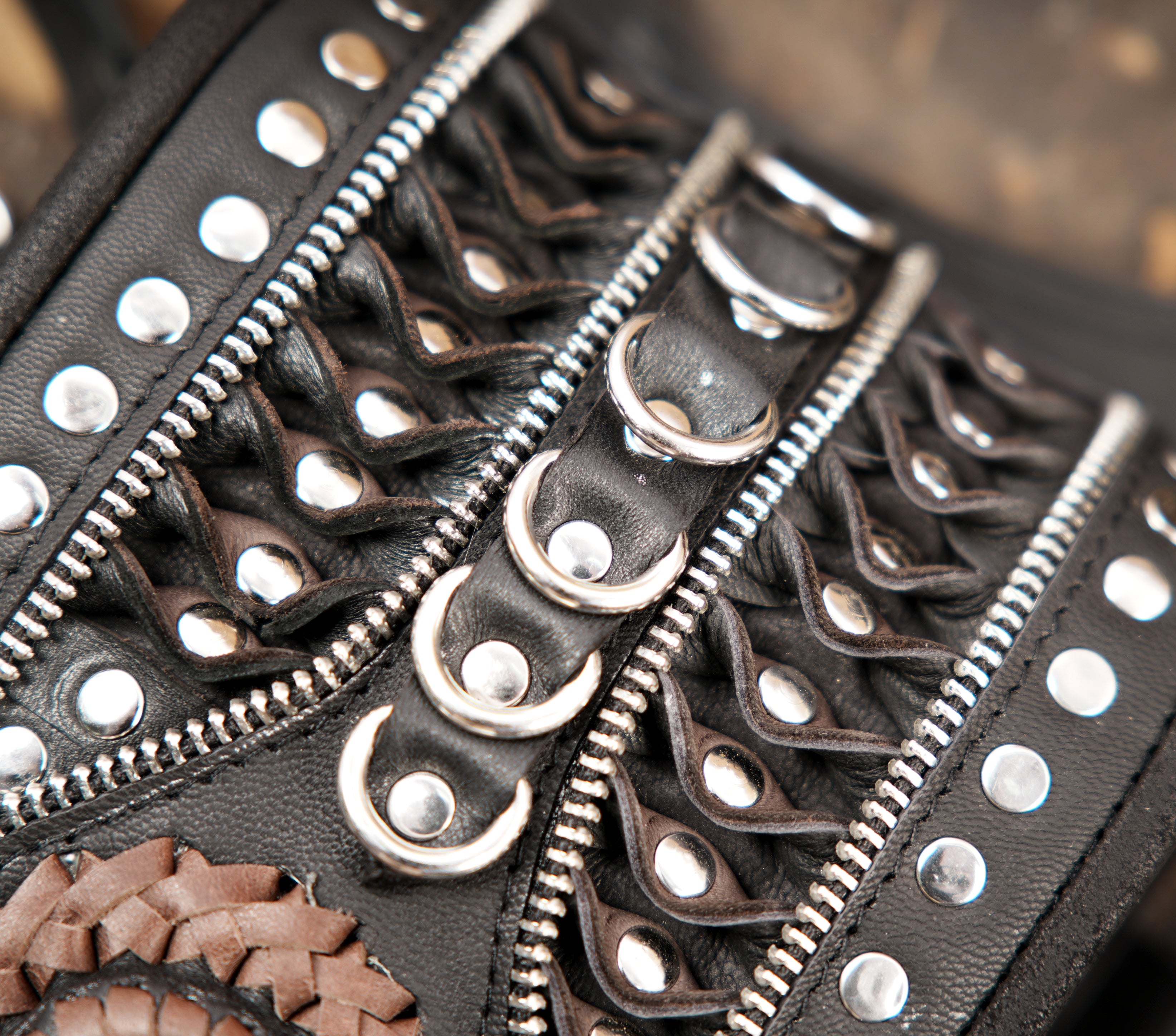 Steampunk-style leather shoulder holster with heavy studded detailing