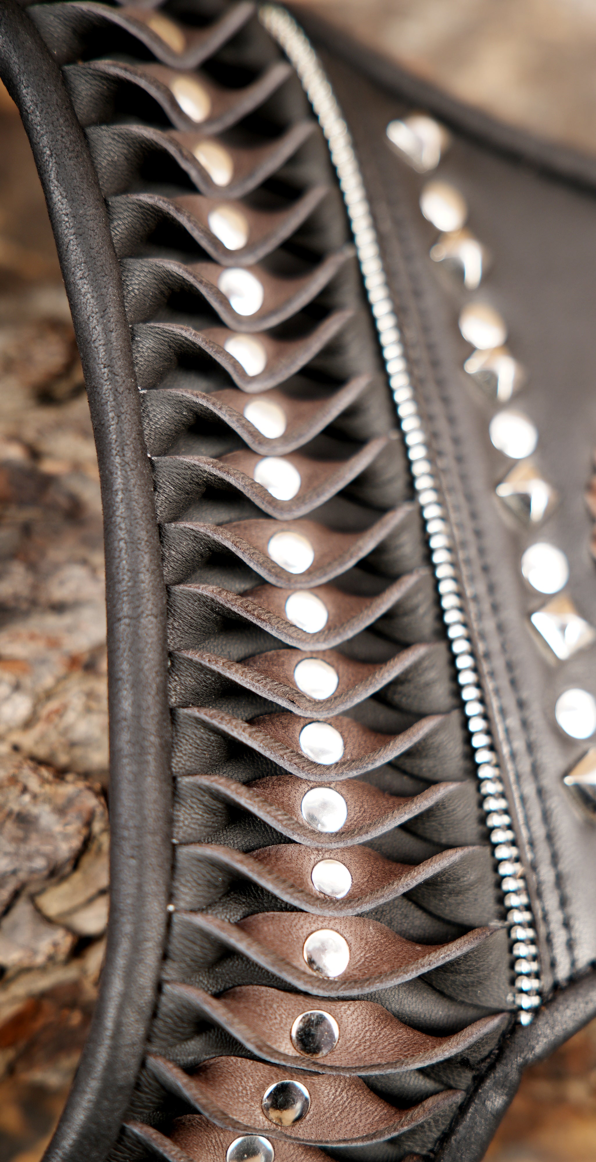 Premium leather dual holster with intricate stitching and rivet design