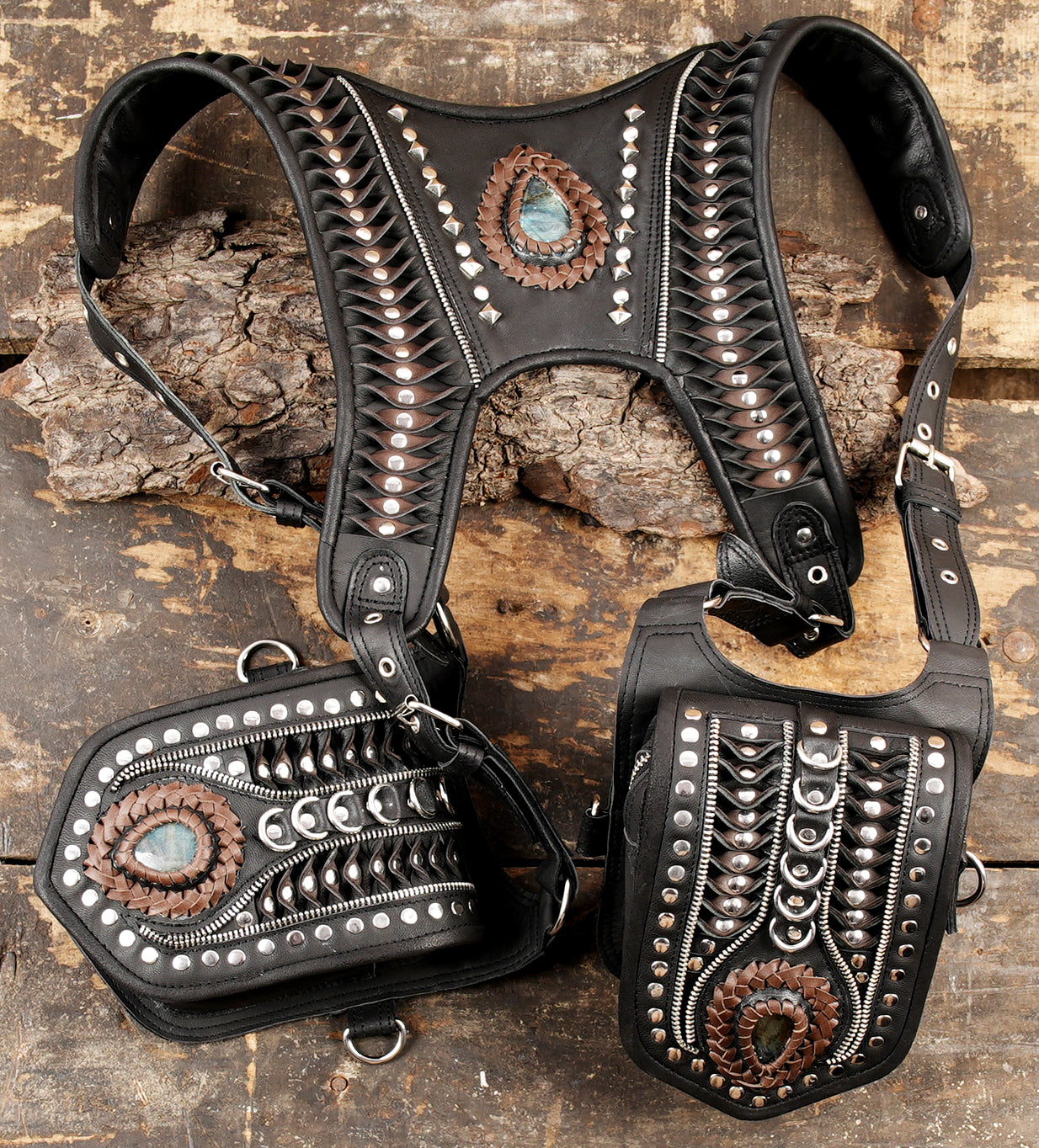 Black shoulder holster with layered leather patterns and metal hardware