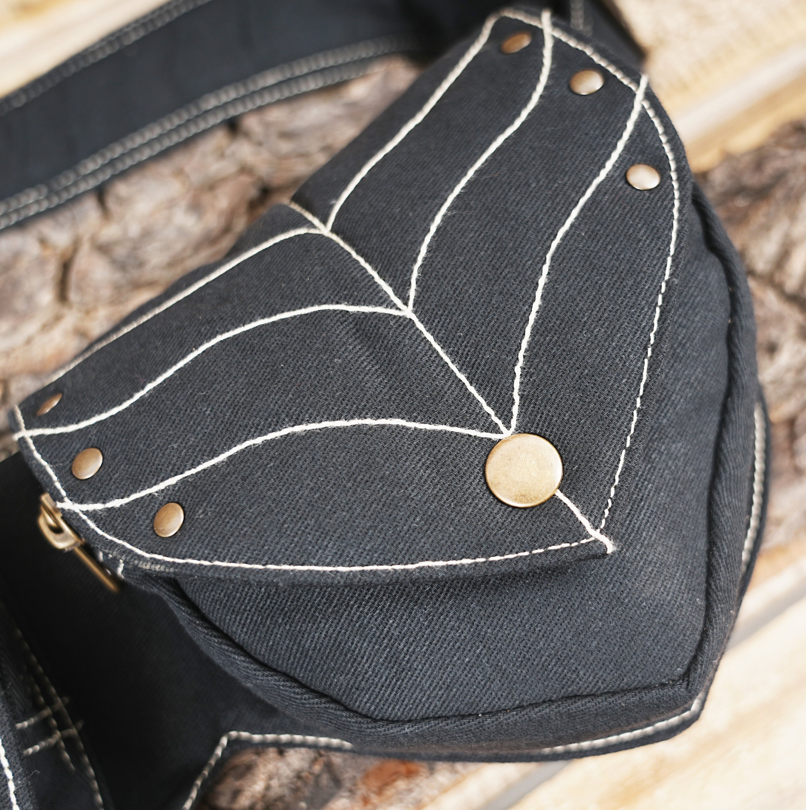 Alternative fashion black leaf-stitch utility belt for festivals and travel