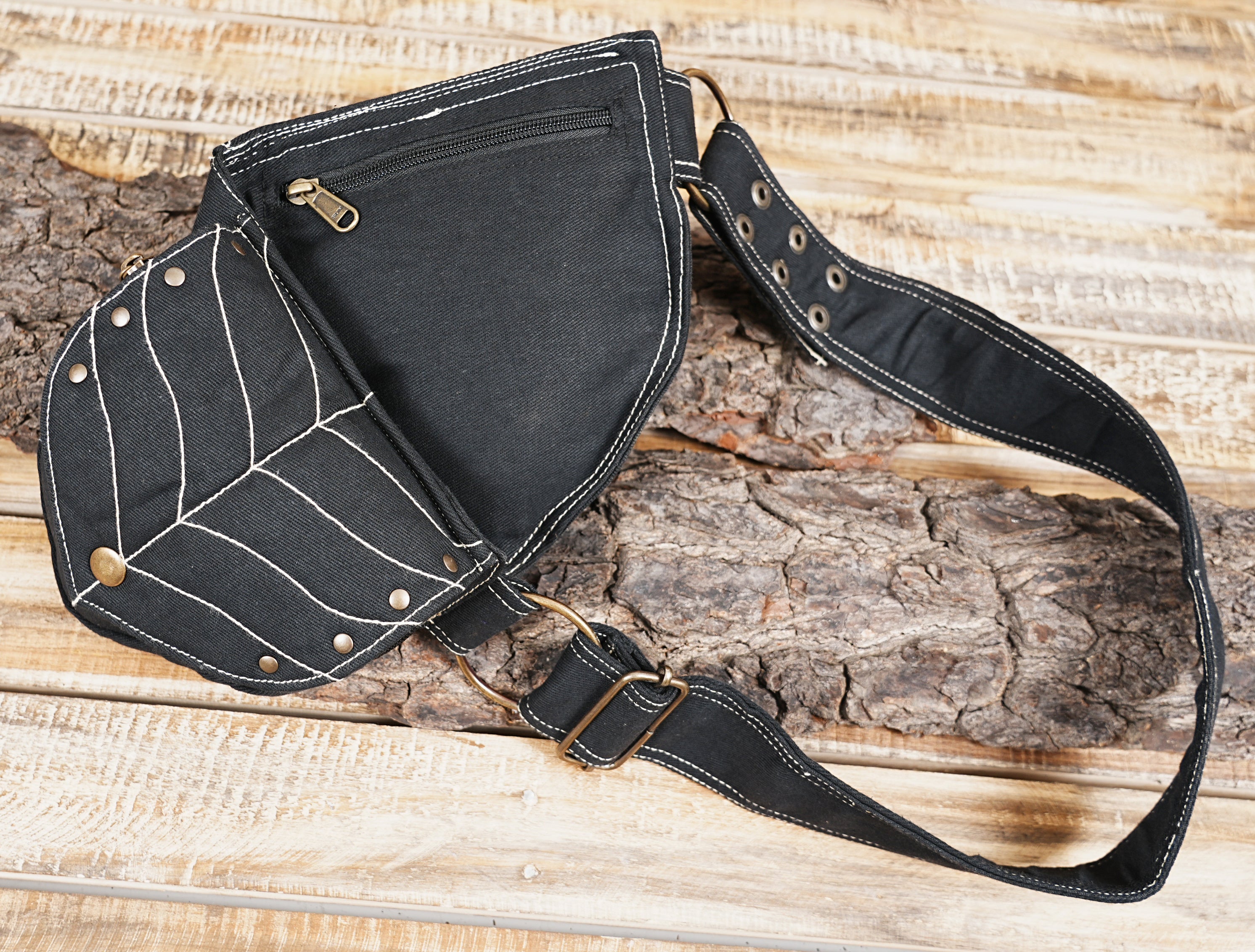 Handmade black festival waist pack featuring a unique leaf contour stitch