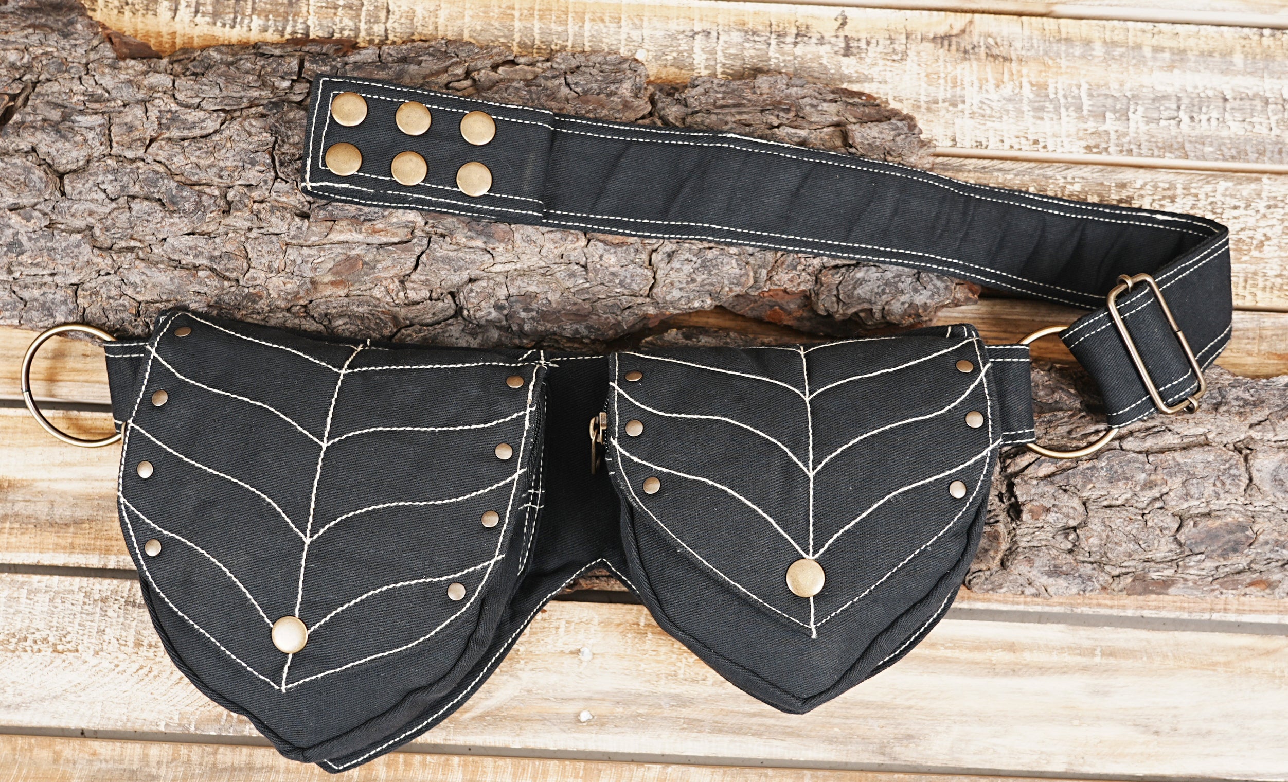 Handmade black waist pack with decorative white leaf vein stitching