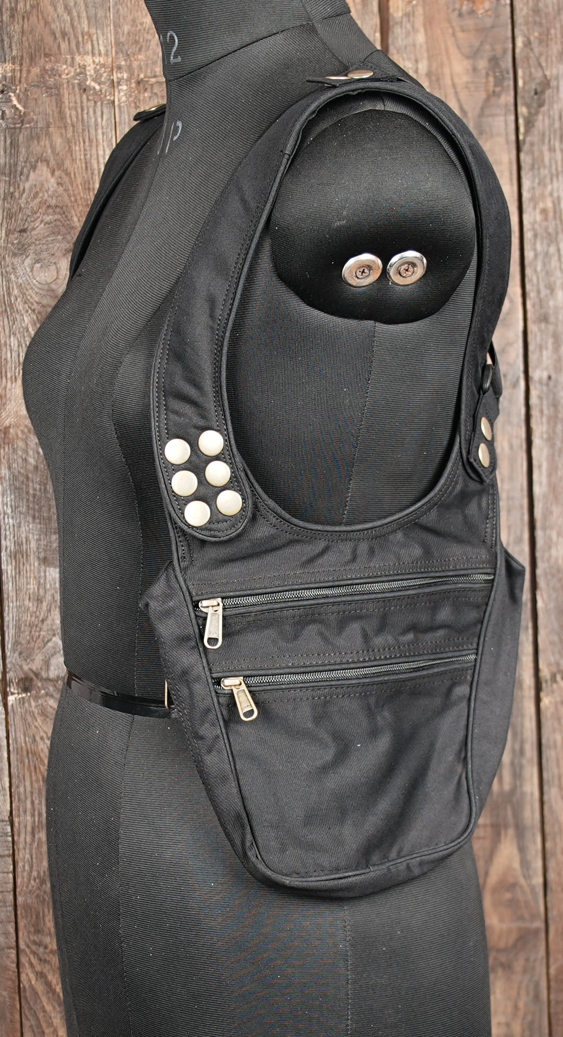 Cotton holster bag featuring durable black cotton fabric and brass hardware