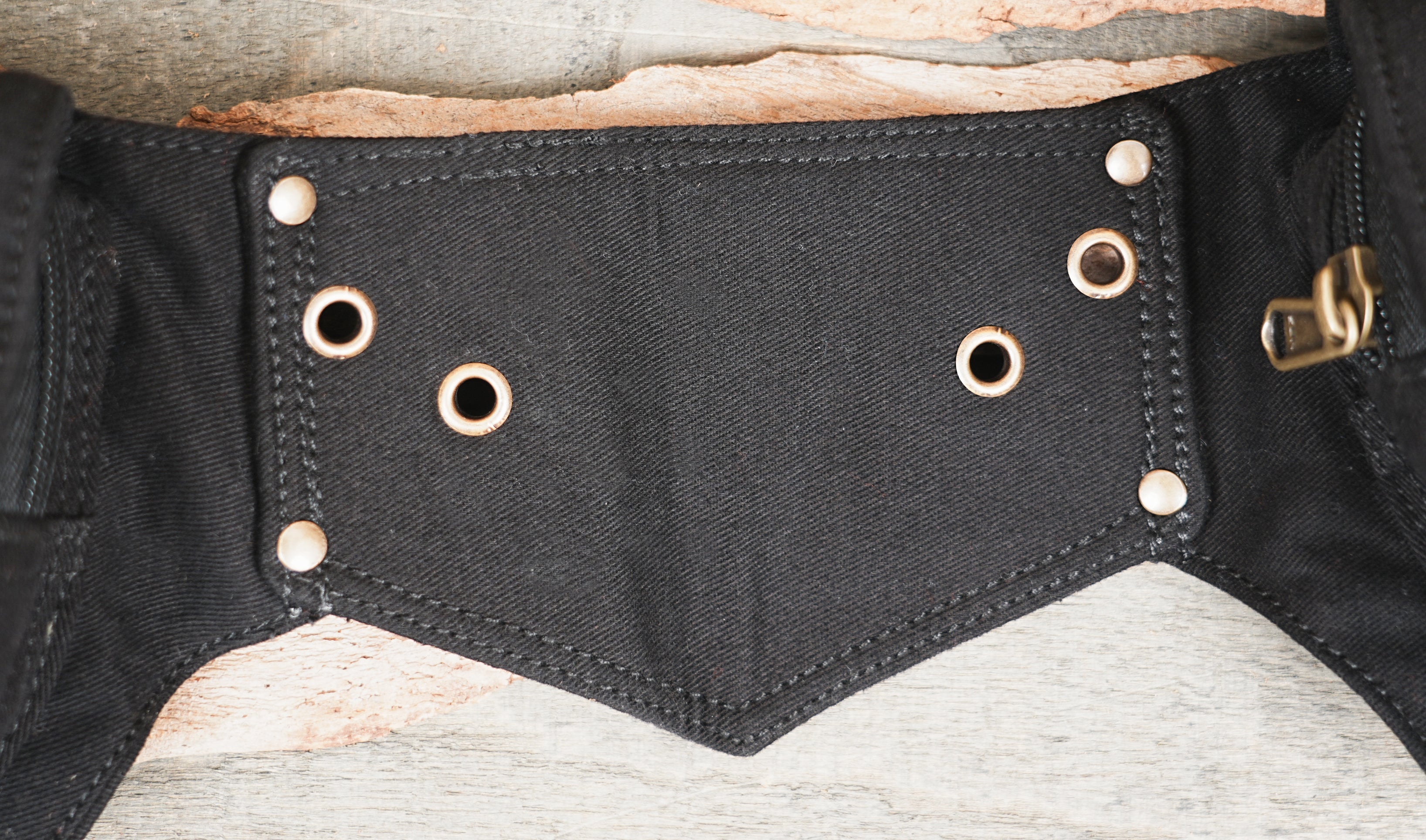 Structured utility belt shown on rustic wood background