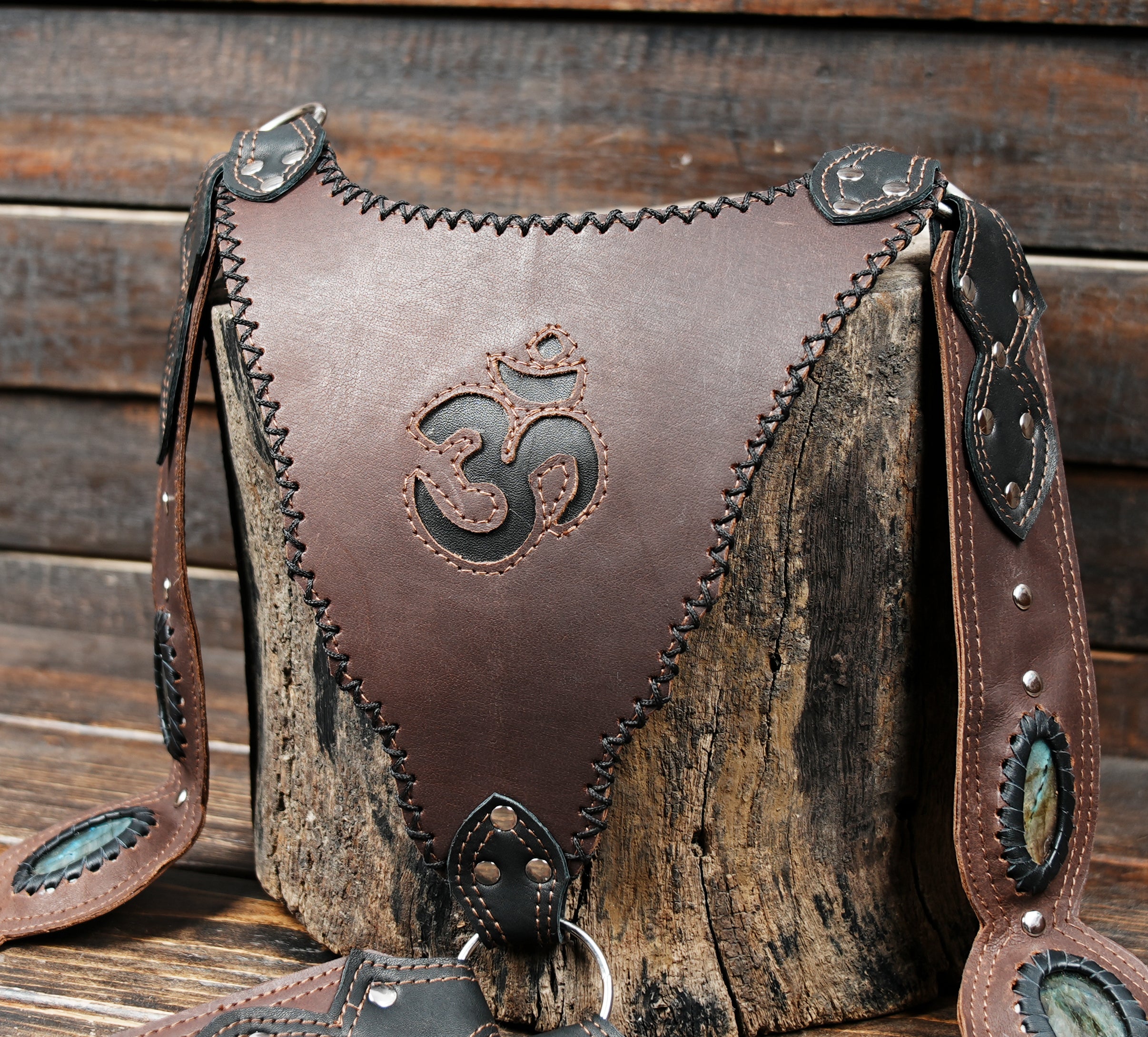 Brown leather festival holster belt with stone inlay and detailed stitching