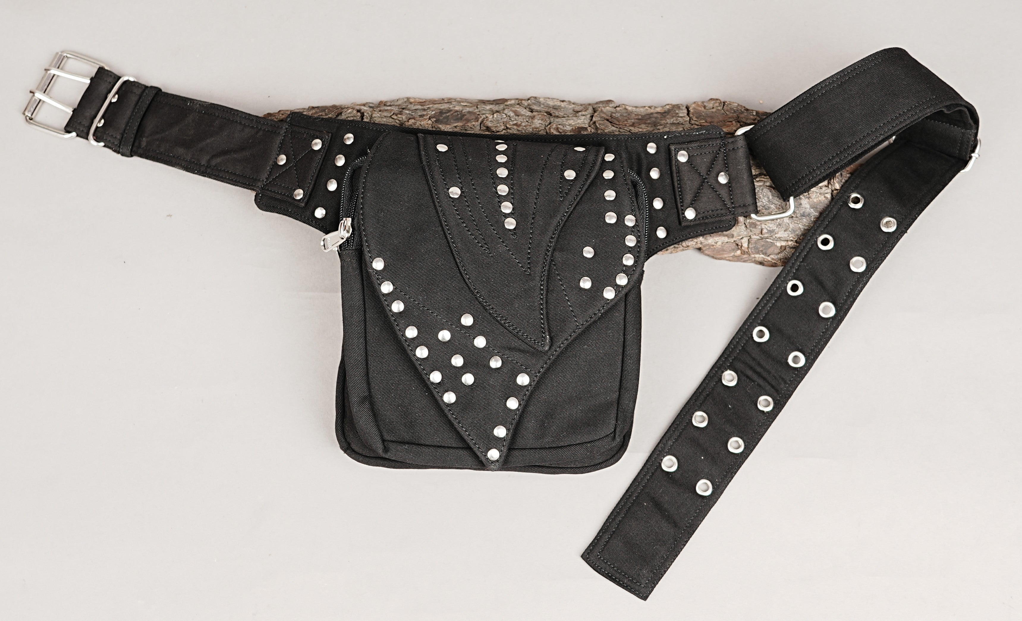 Hands-free utility pouch: black canvas fanny pack with studded and laced details.
