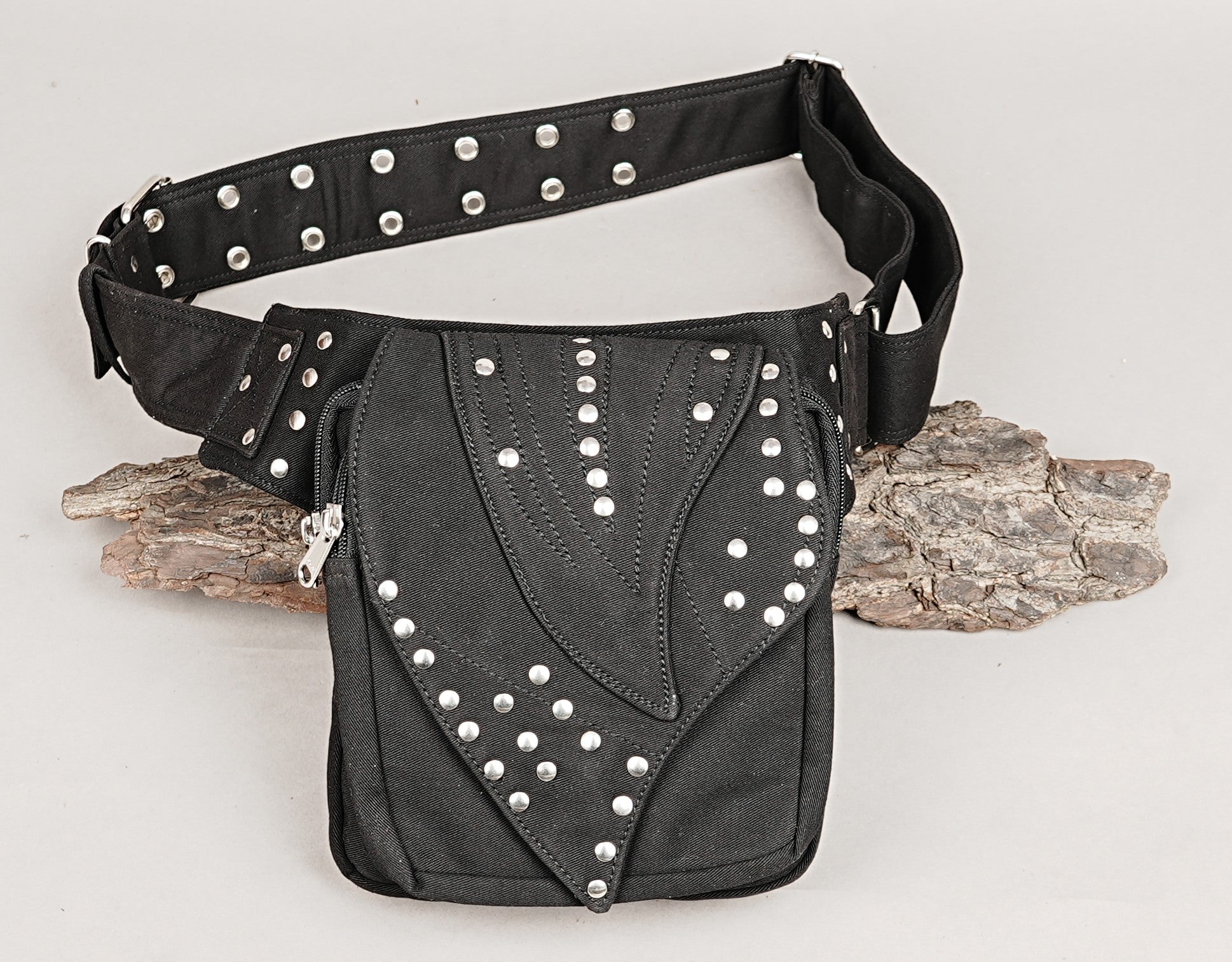 Adjustable canvas hip belt bag with black floral lace, metal studs, and functional O-rings.