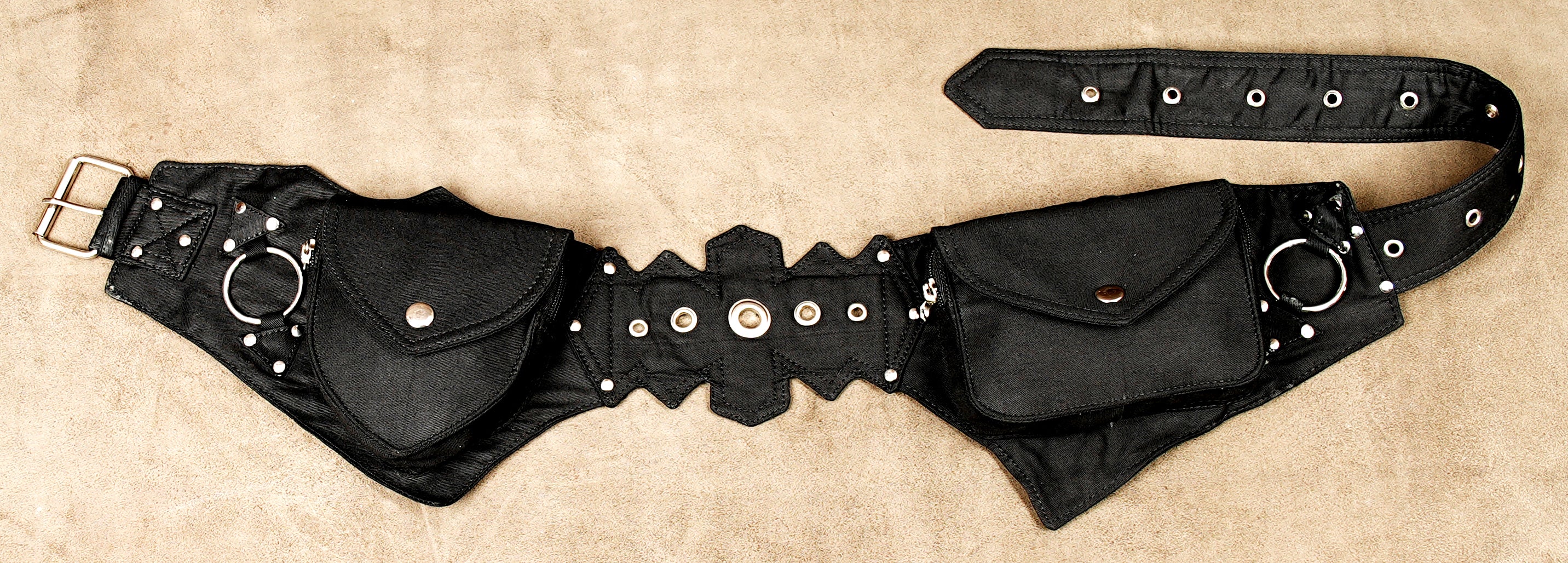 Steampunk adventurer utility belt with multiple canvas pockets and stud details.