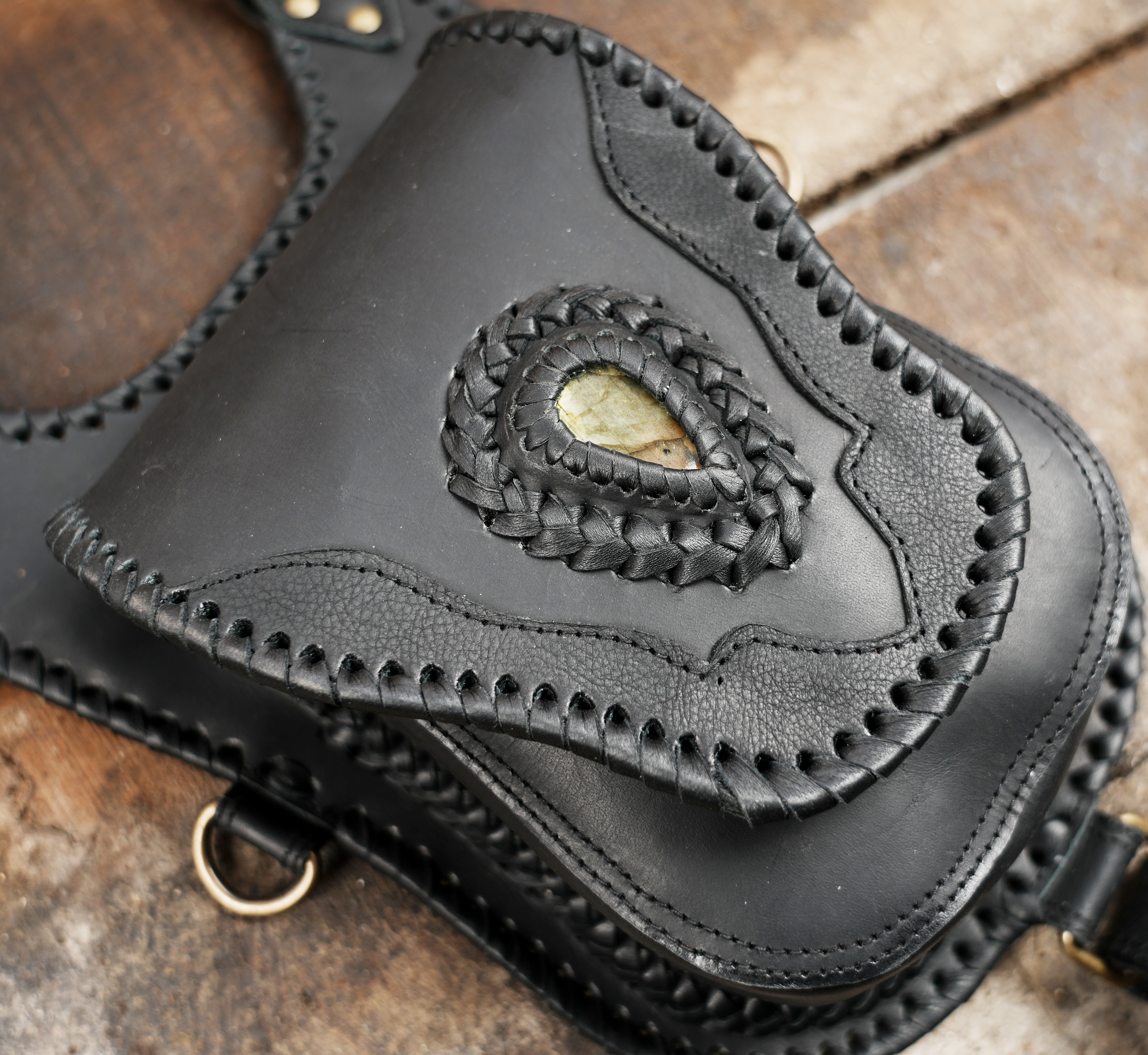 "Dual pocket leather holster harness with gemstone detailing"