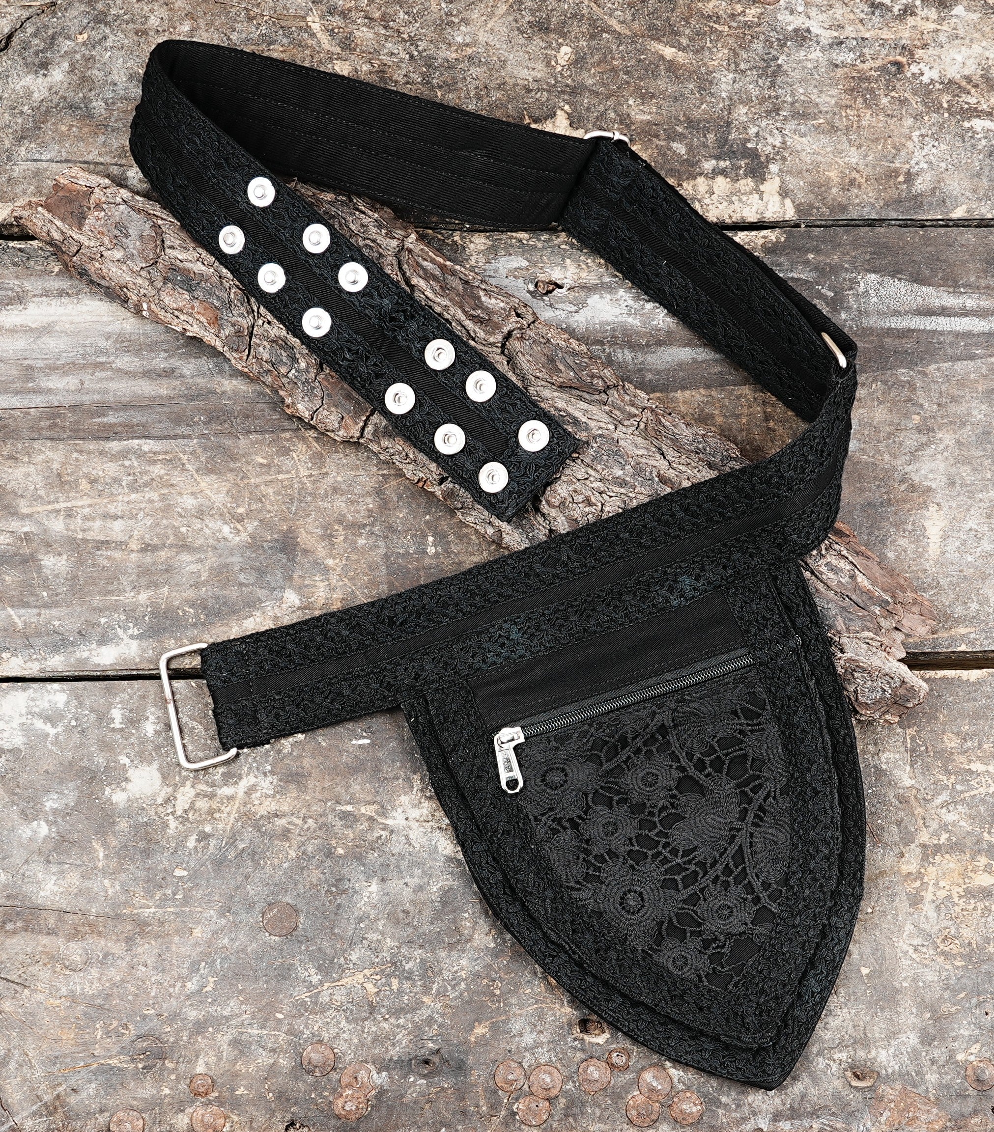 Compact black waist pack in cotton, perfect for hands-free travel, with a decorative lace panel.