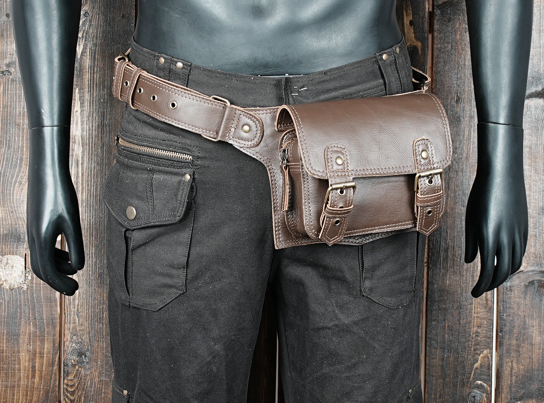 Crossbody style leather waist pack with buckle closure