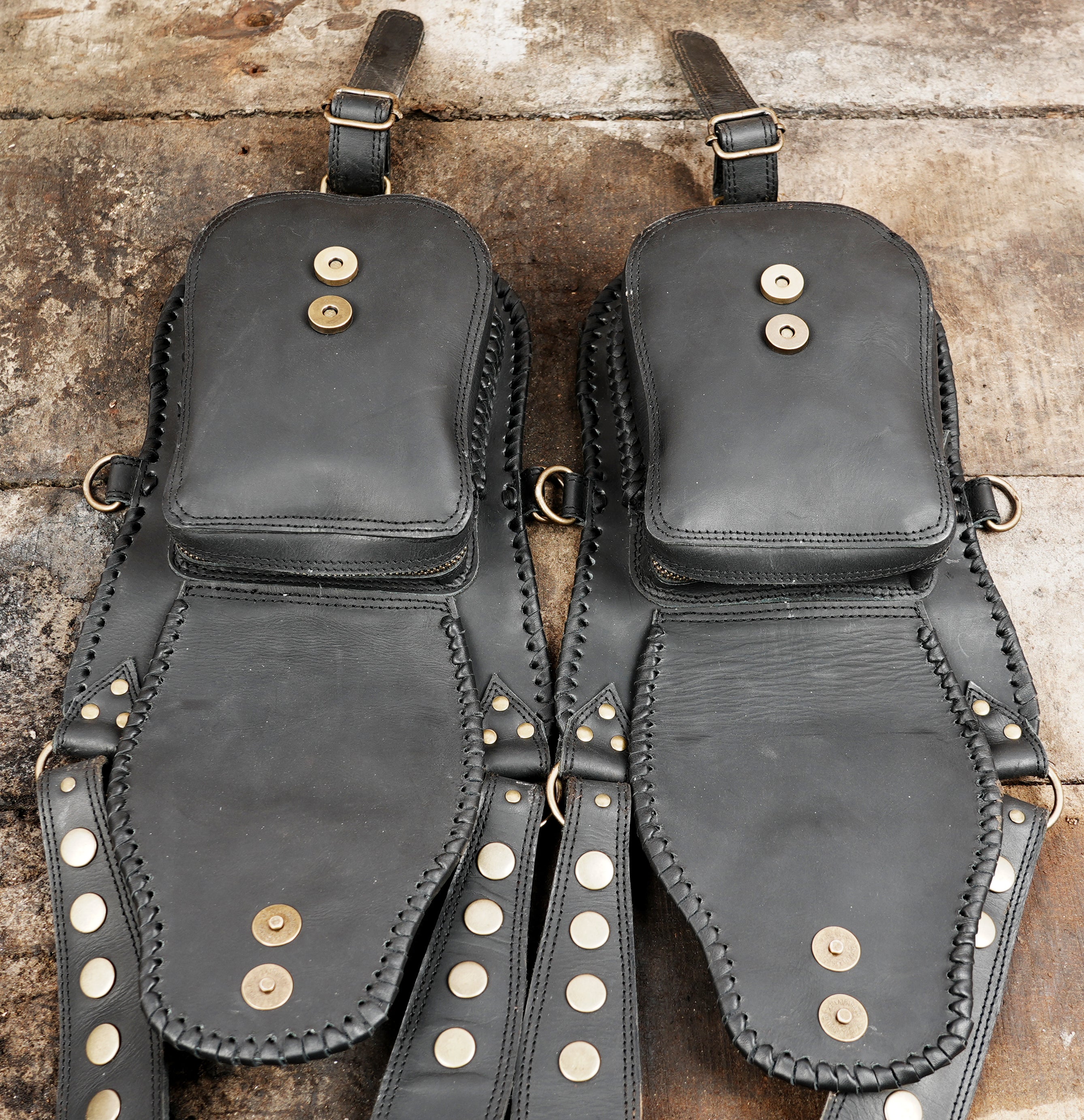 "Black leather holster for festivals and outdoor utility"