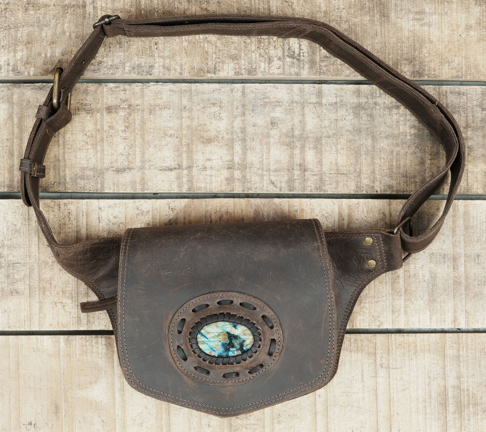Artisan crafted leather belt bag with natural stone highlight