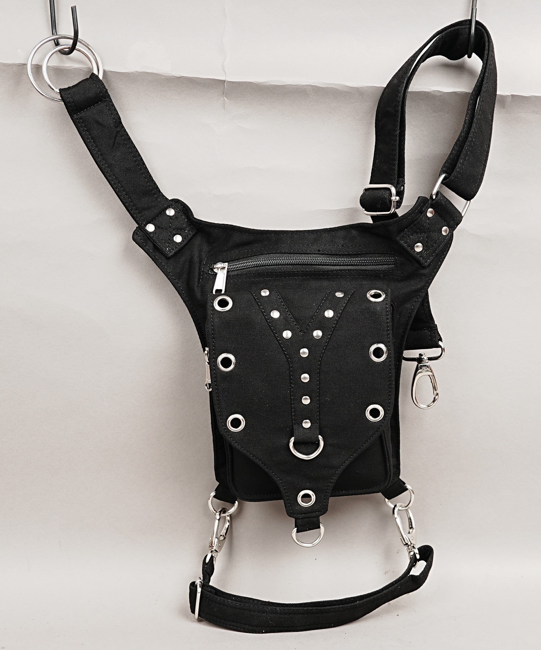 Unisex black canvas hip bag with secure leg harness strap