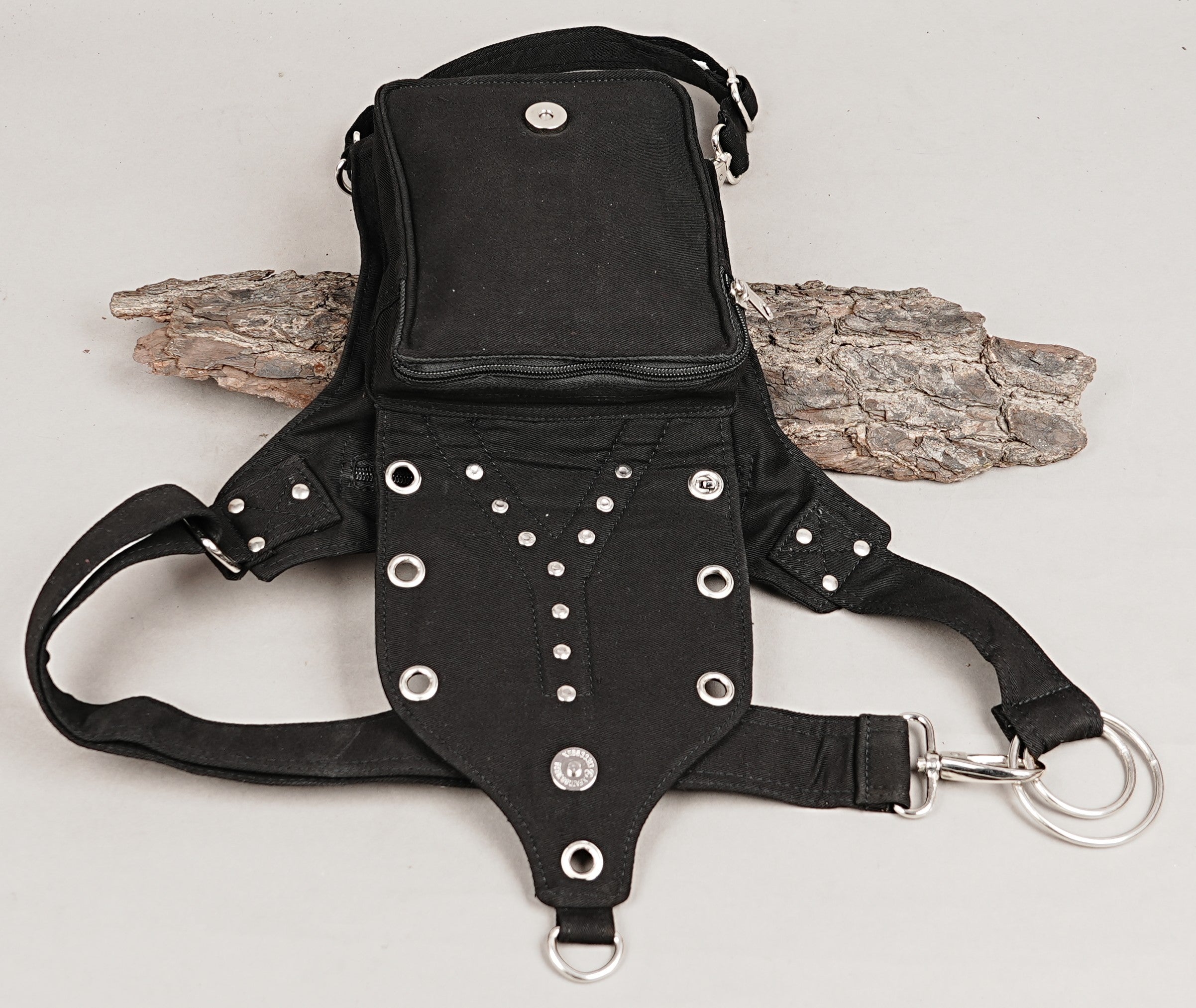 Industrial punk style black canvas drop leg bag with studs