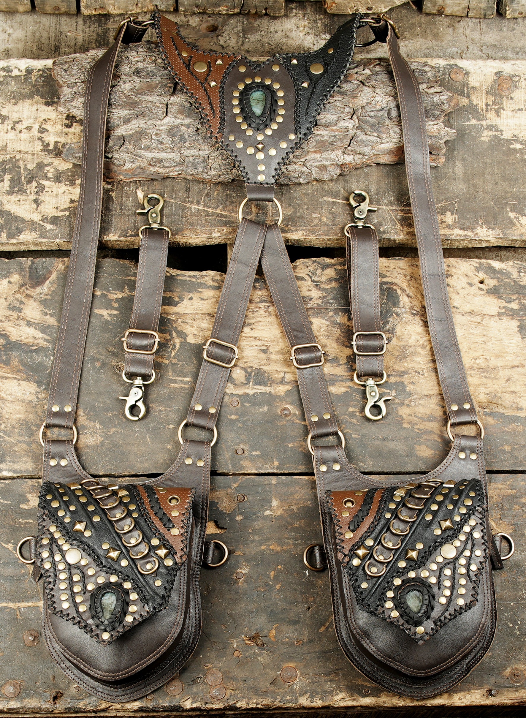 leather dual holster with antique brass fittings