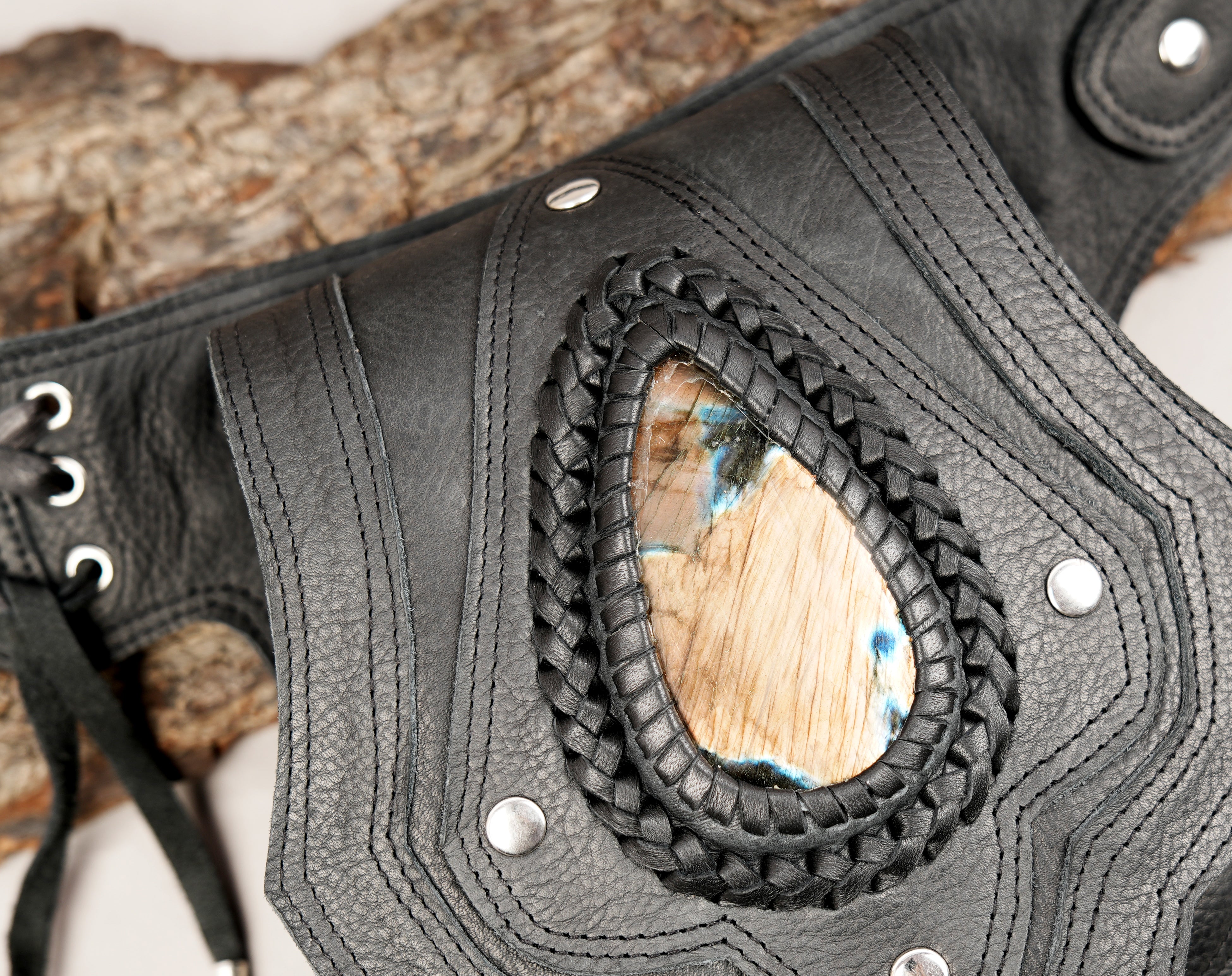 Adjustable black leather waist belt with decorative stone