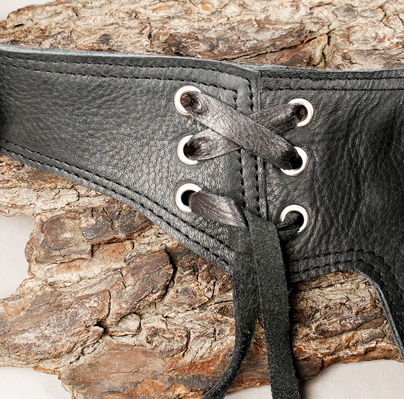 Artisan leather waist belt with hand braided trim