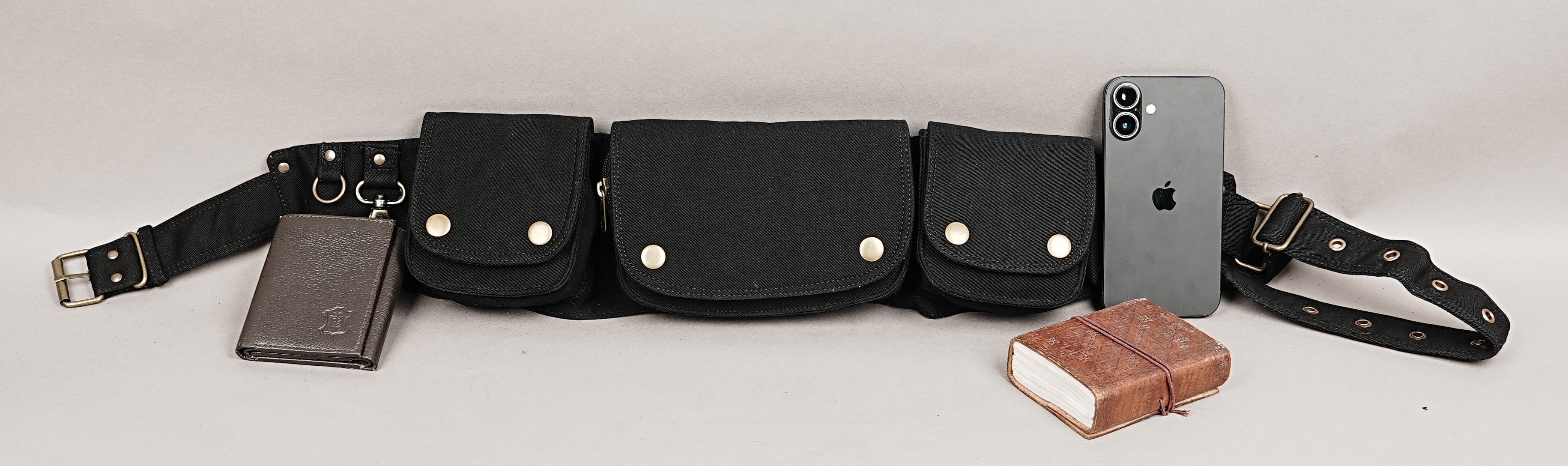 Traveler's multi-pouch waist bag, black cotton with different sizes for passport and electronics.