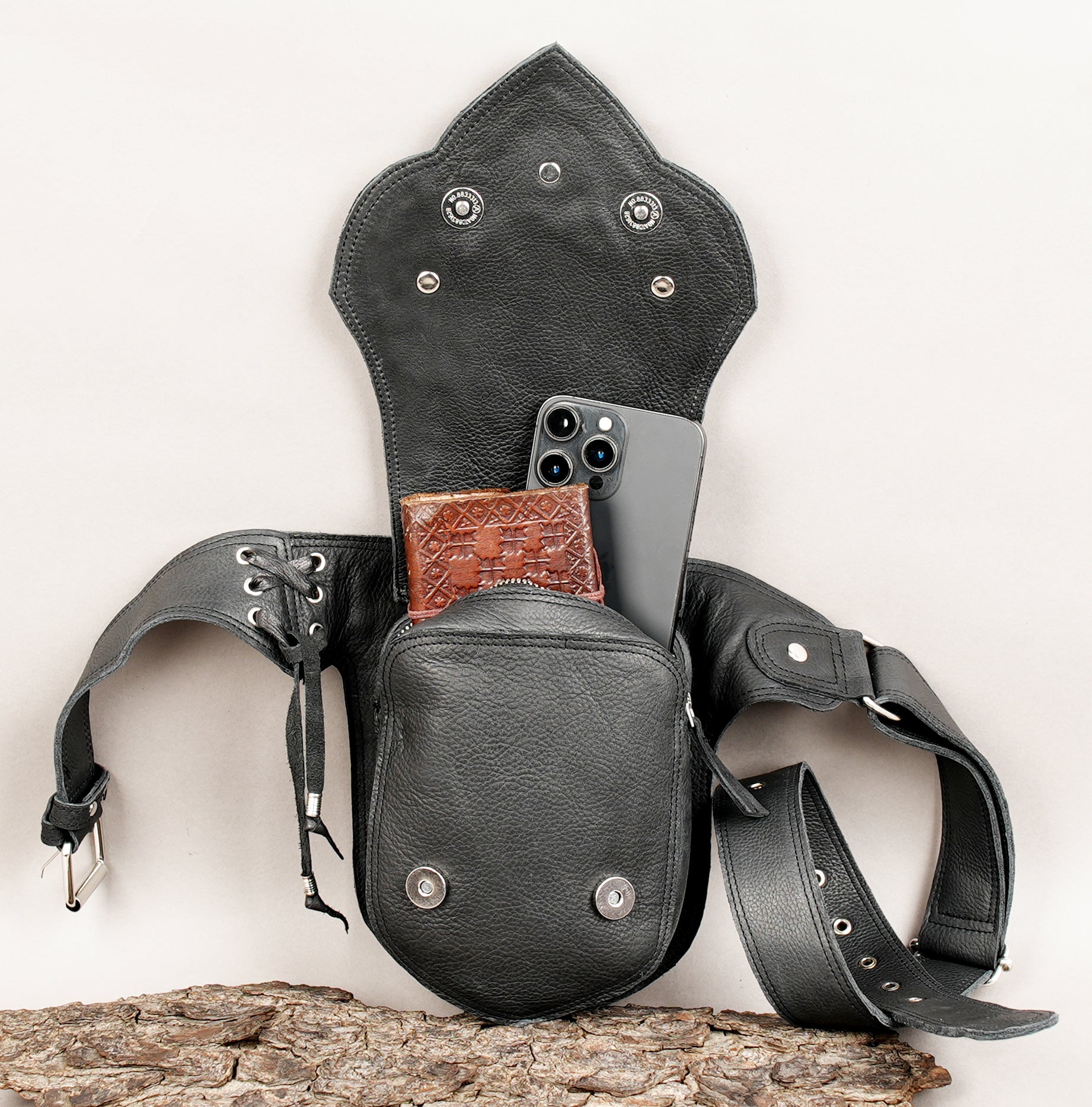 Handcrafted leather hip belt with braided edging