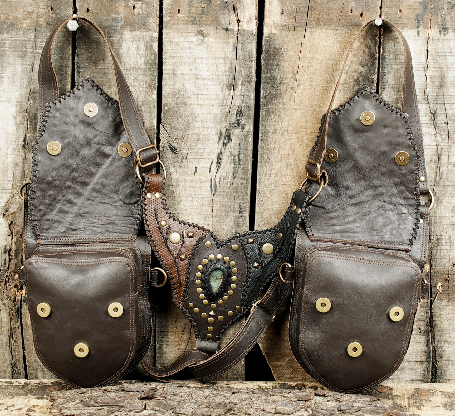 Tribal leather shoulder holster with handmade stitching and rivets