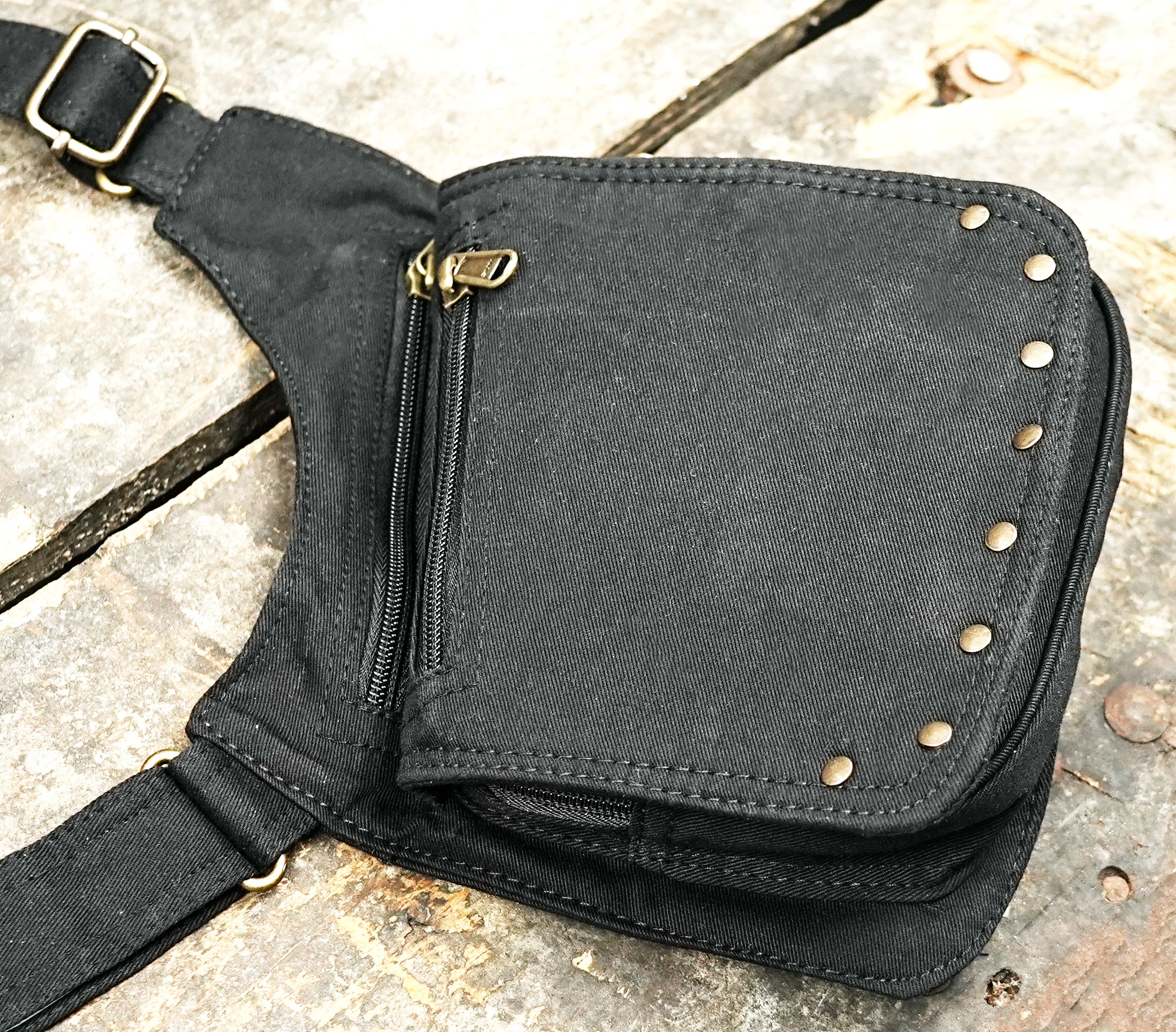 Cross body holster rig with studded pouches on both sides