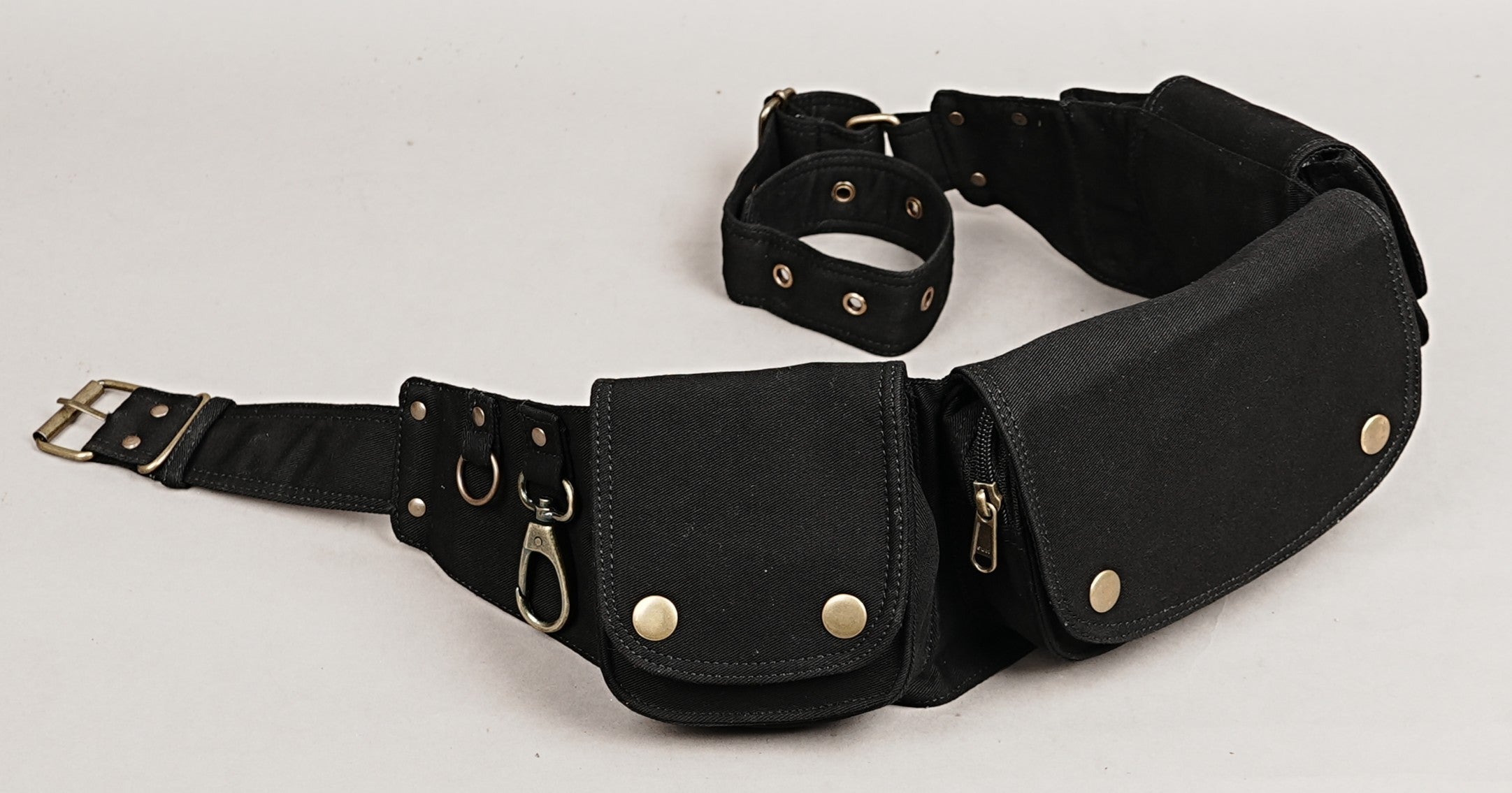 Goth/punk aesthetic black utility belt, three main zippered compartments with a large brass ring.