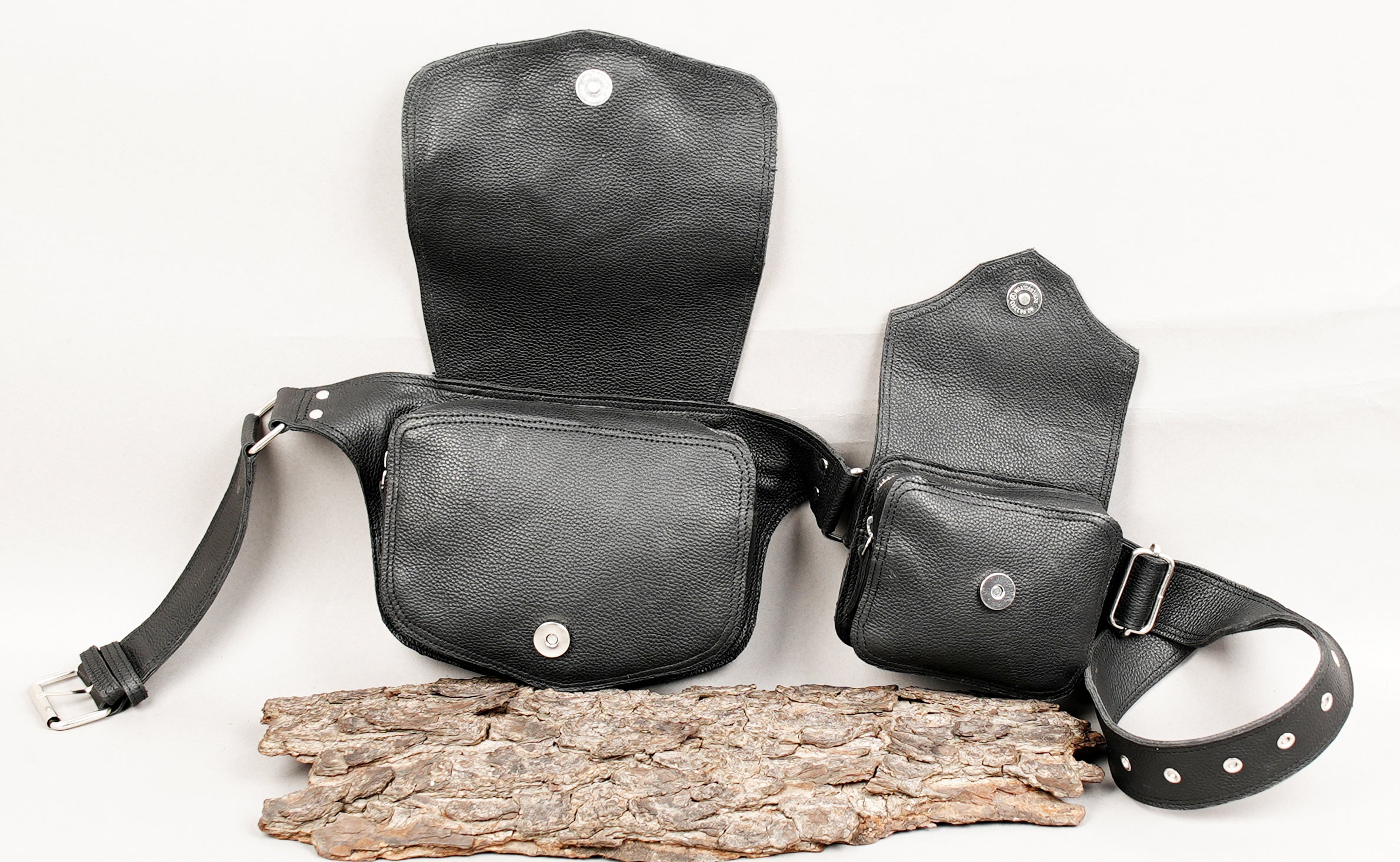 Adjustable black leather waist belt with metal hardware