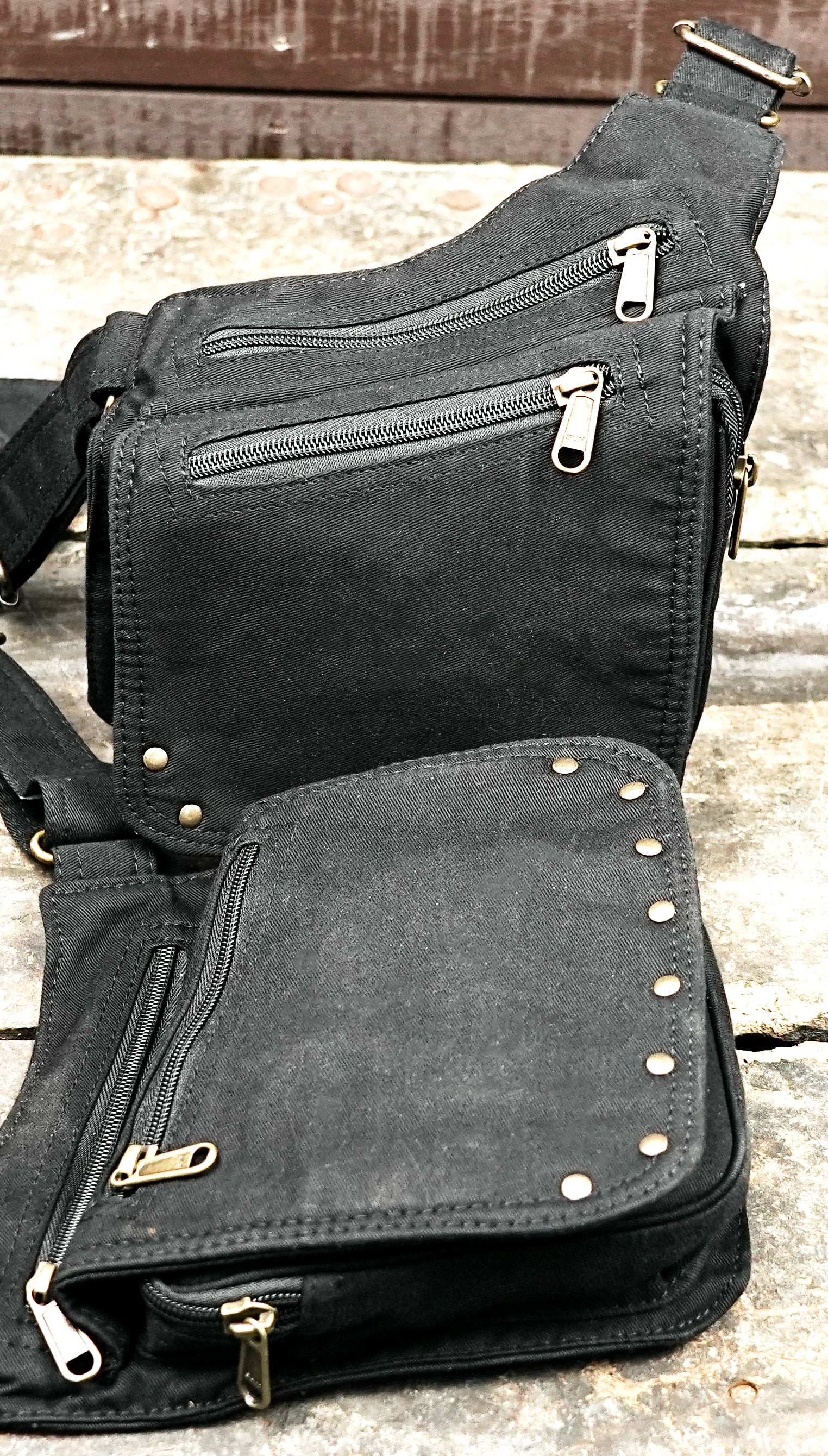 Dual pouch chest harness shown flat on wooden background