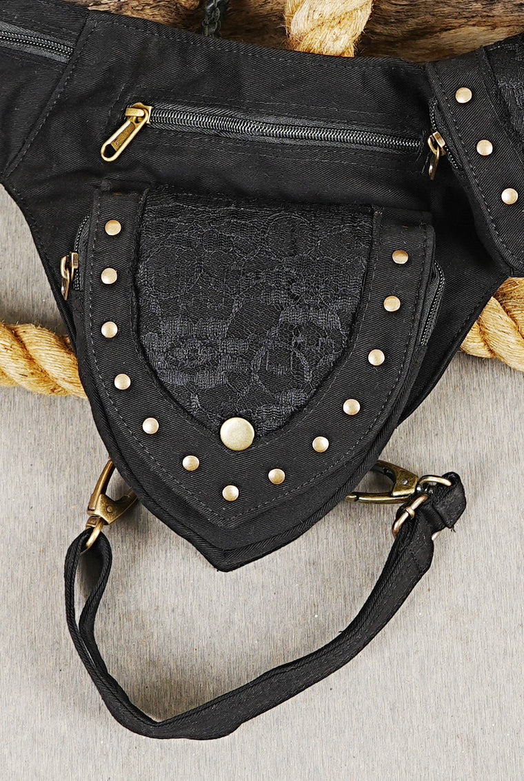 Festival thigh pocket belt with delicate dark lace flap and studded detailing.