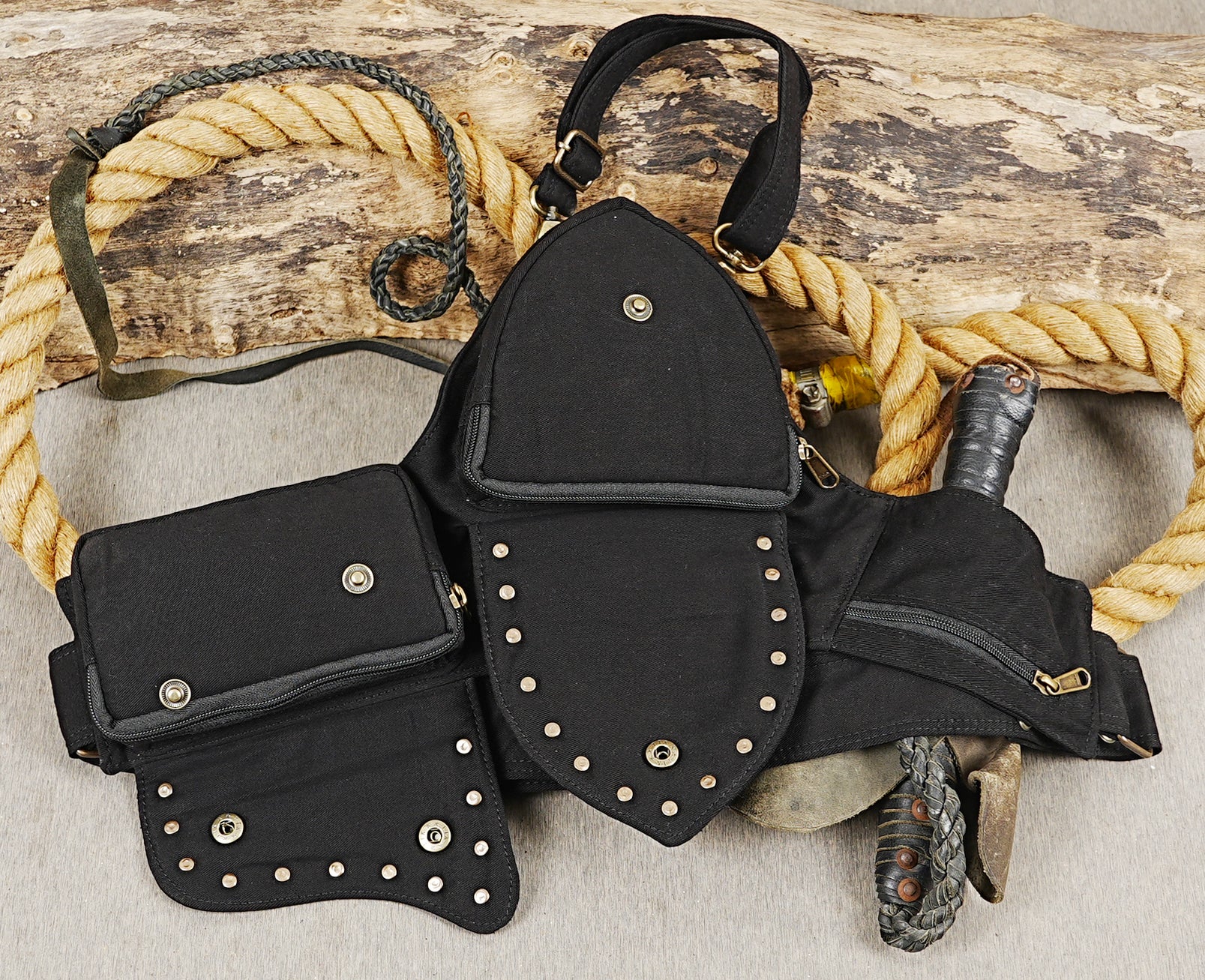 Steampunk motorcycle hip bag with secure zip pockets and pointed lace flap detail.