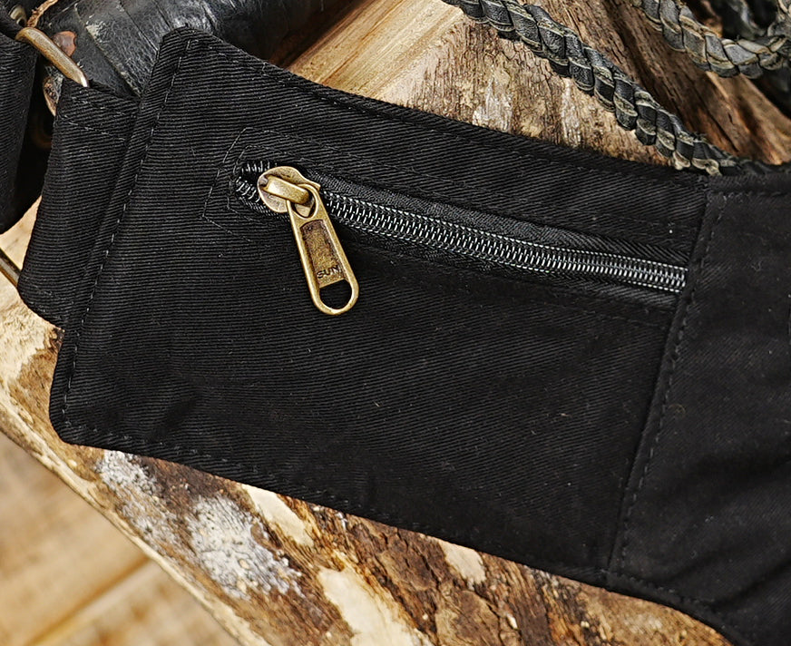 Tribal style canvas side thigh pack with studded flap pockets and metal grommets.