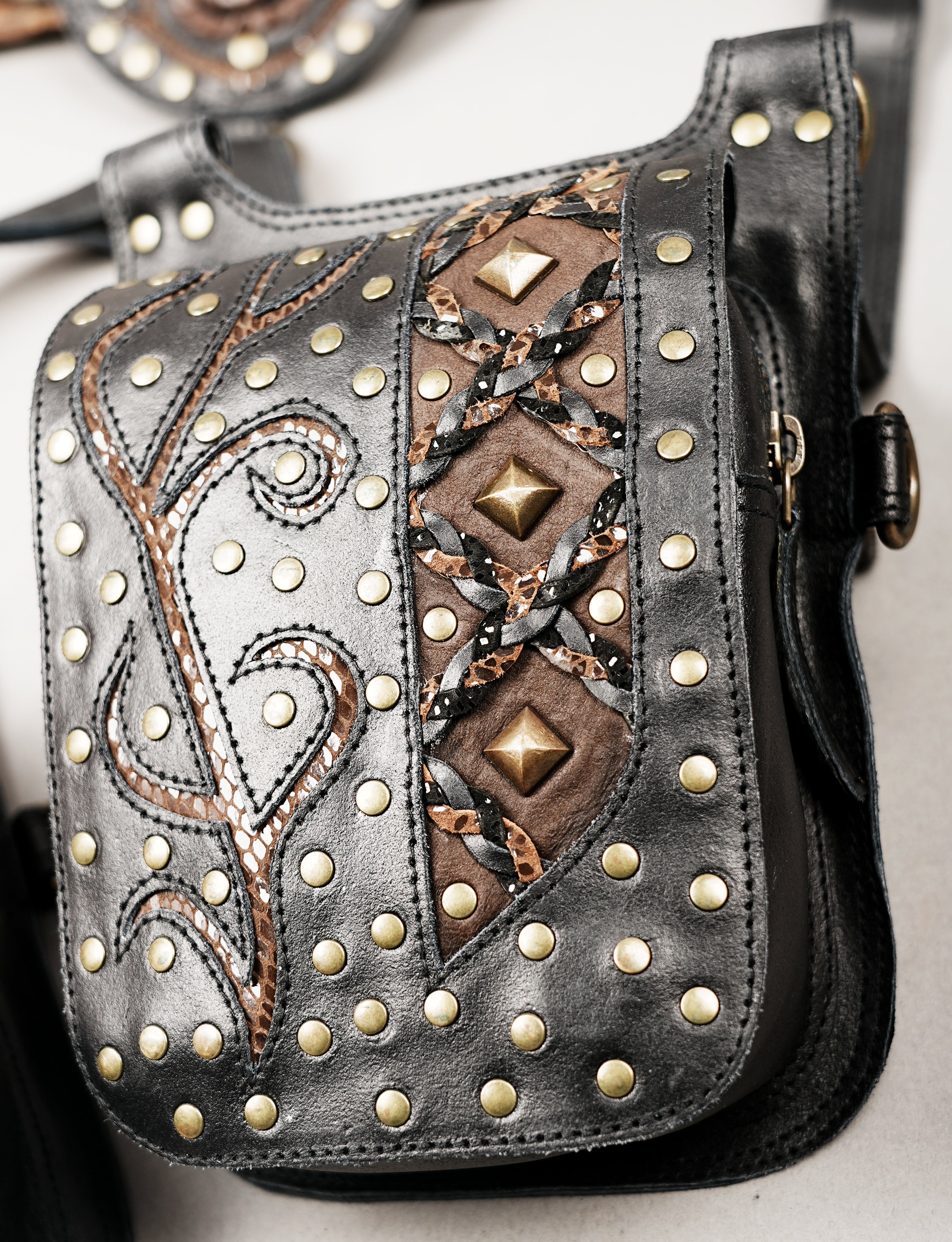 Adjustable leather shoulder holster with dual pockets for everyday carry