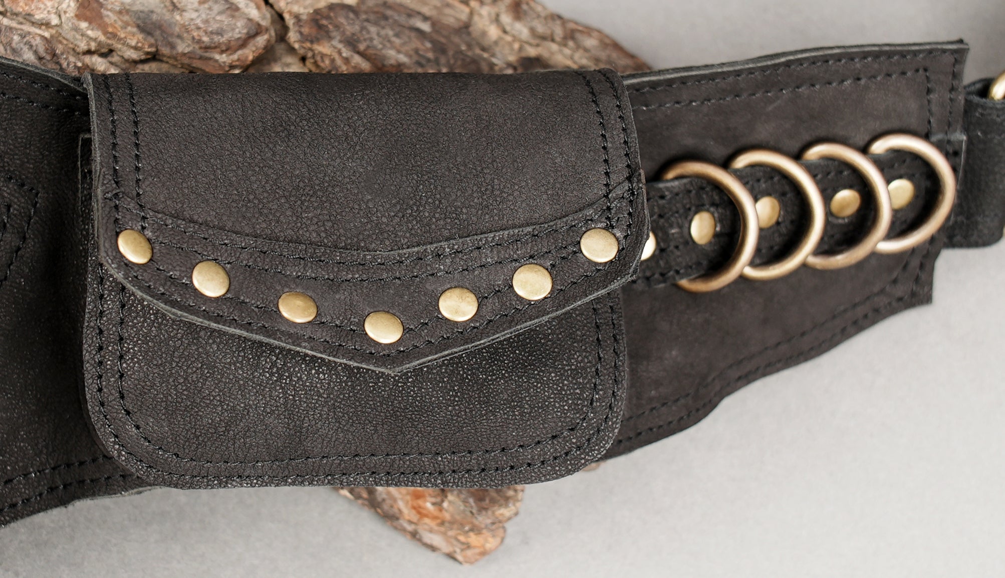 Black leather hip belt with gemstone inlay and long fringe