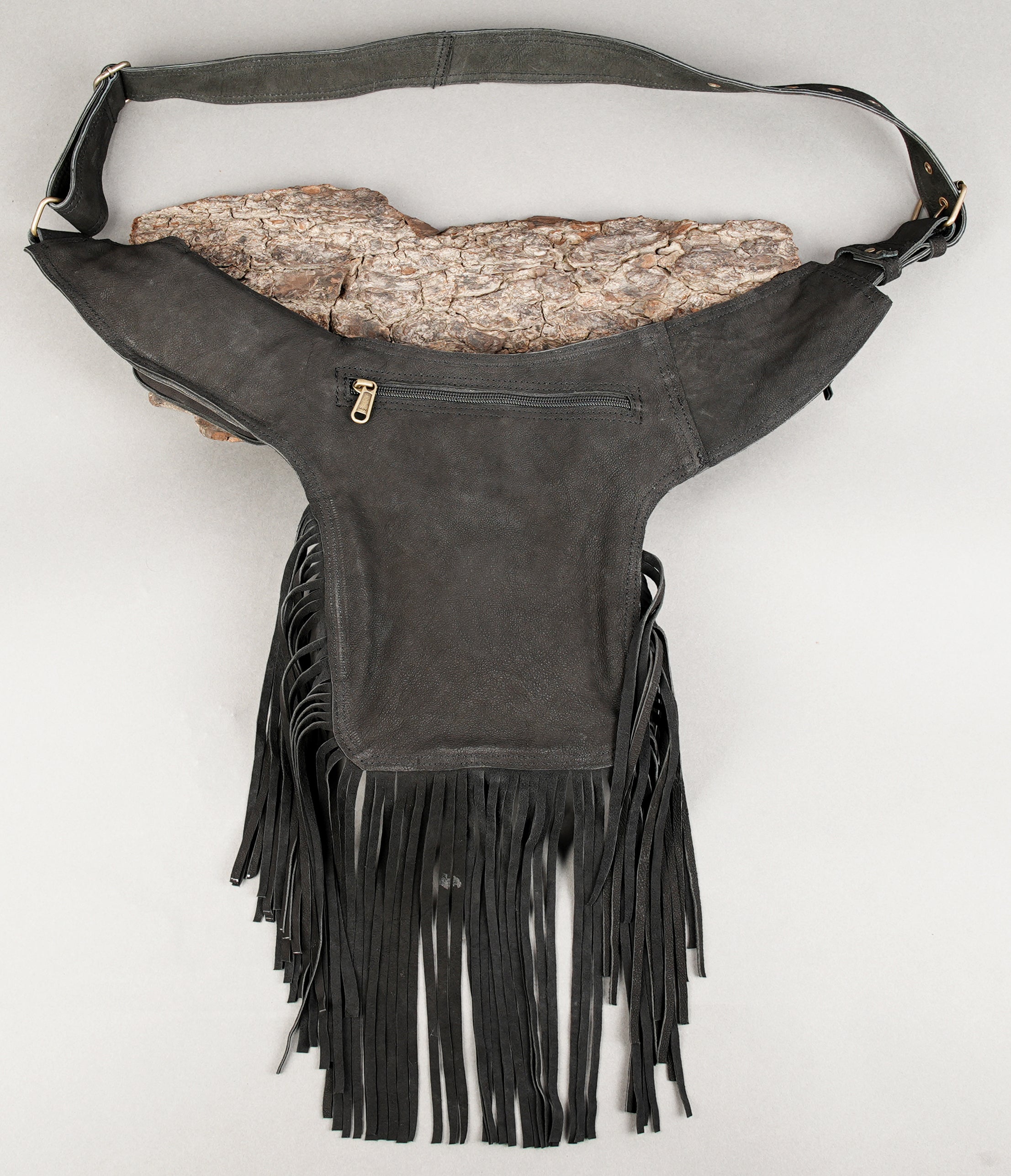 Handmade leather hip bag with fringe and secure zip closure