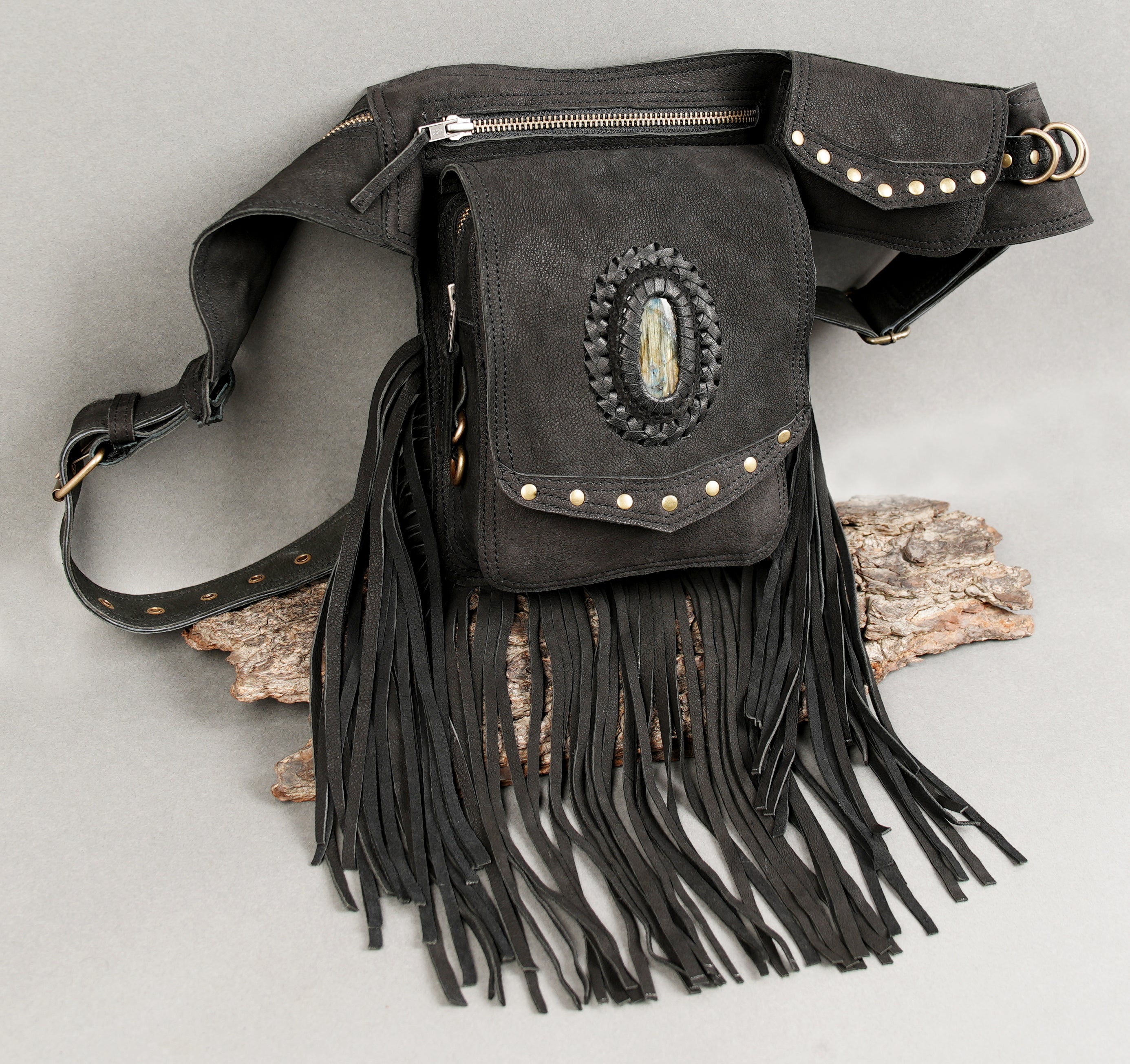 Leather utility belt with gemstone centerpiece and decorative fringe