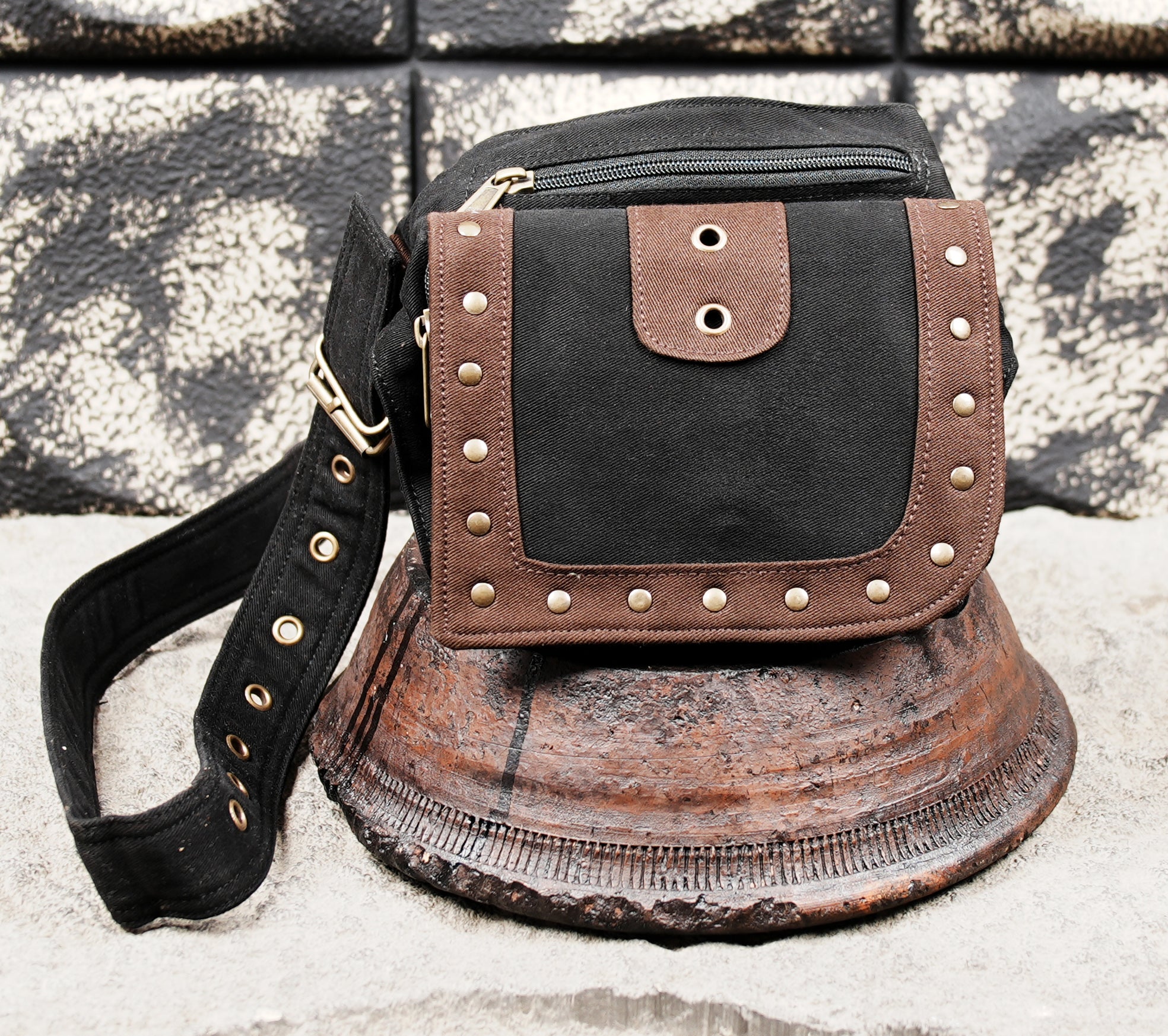 Black canvas belt bag with front flap storage pocket