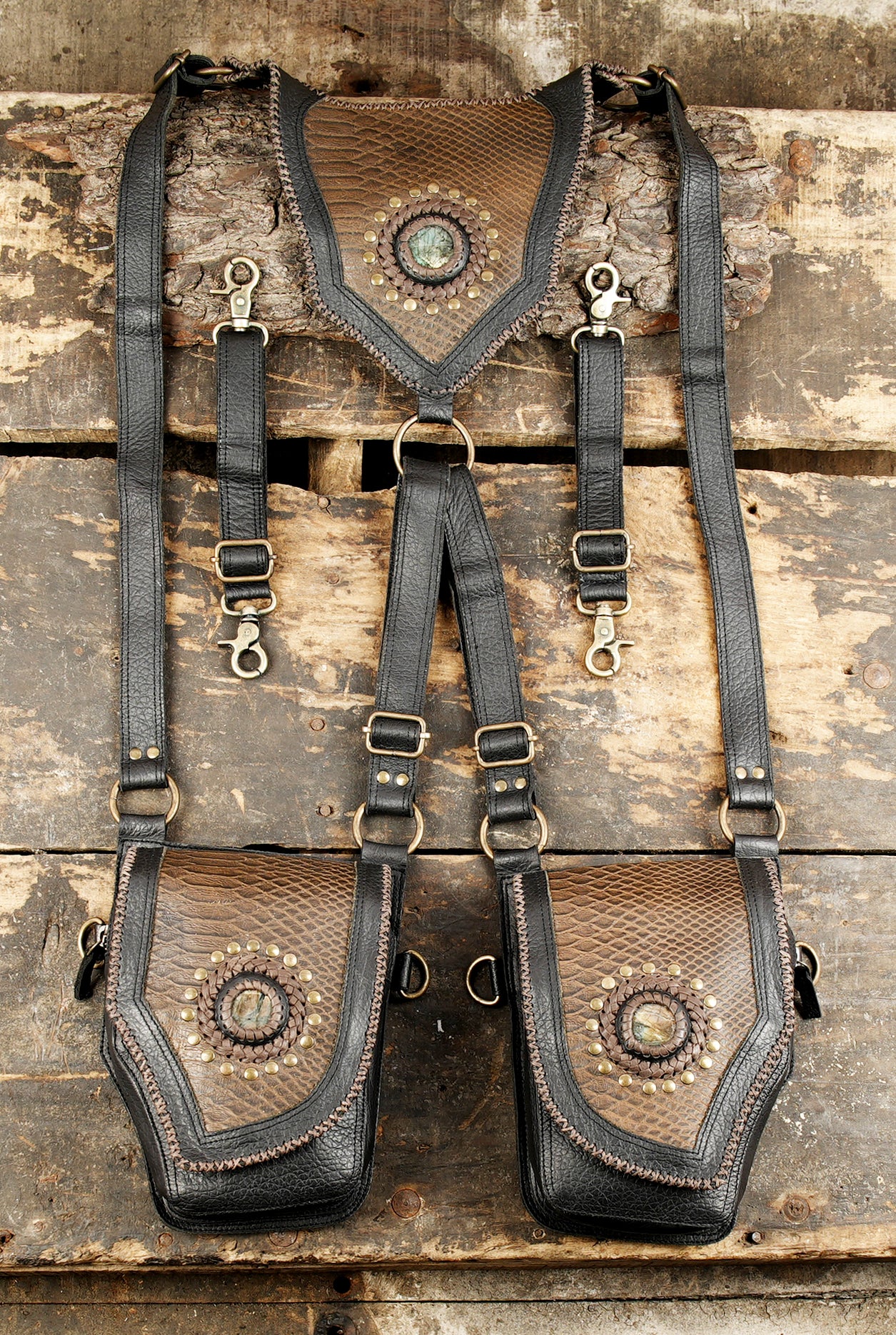 Leather shoulder holster with twin storage pockets