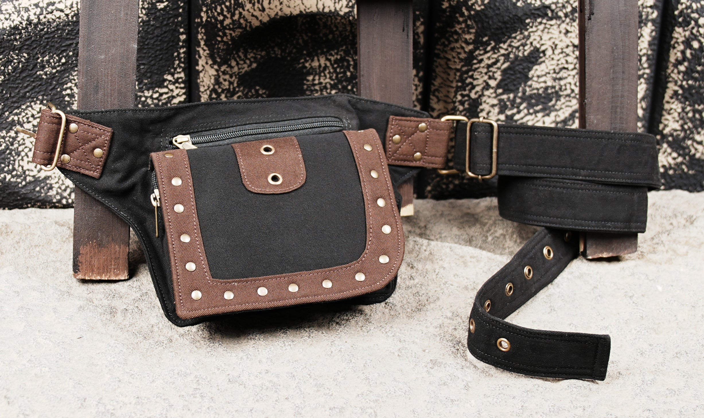 Black utility waist pack with front pocket closure