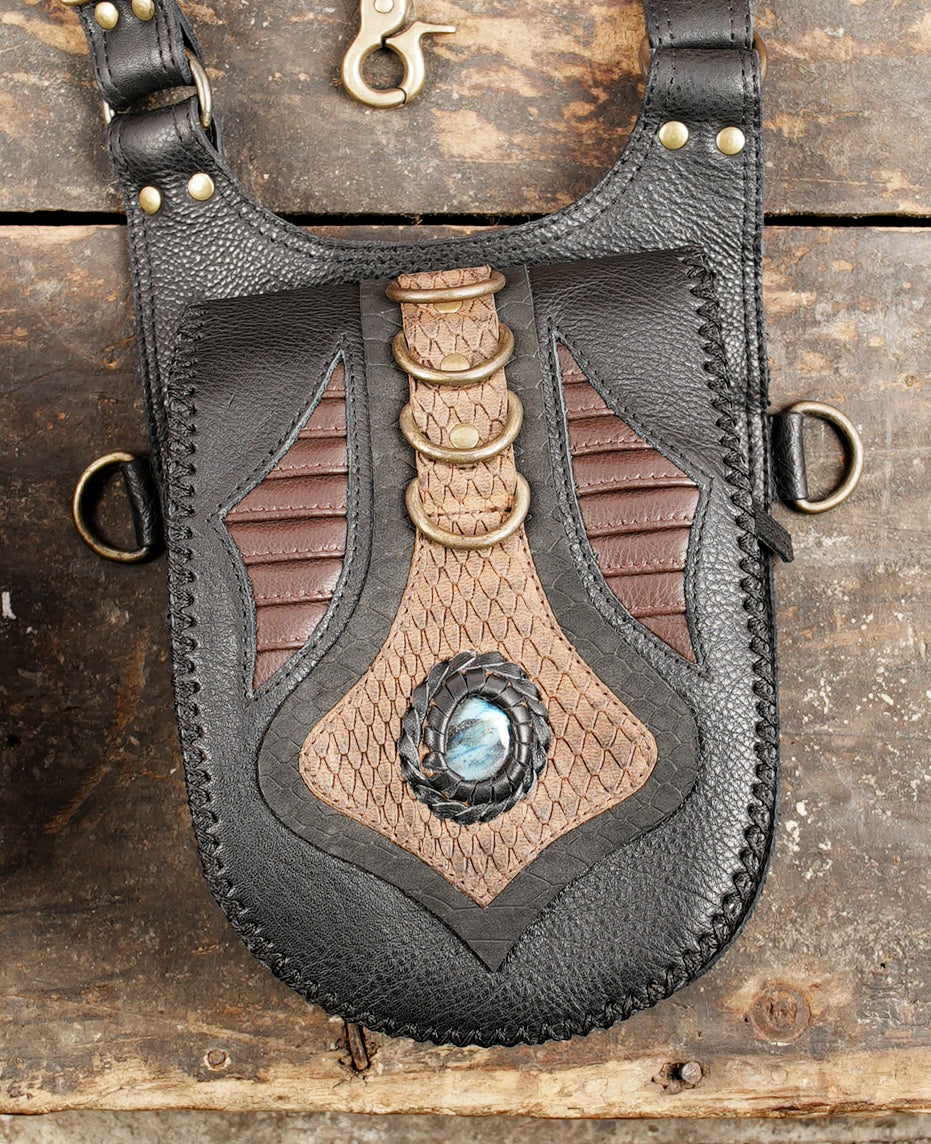 Tribal style leather holster with natural stone centerpiece and brass hardware