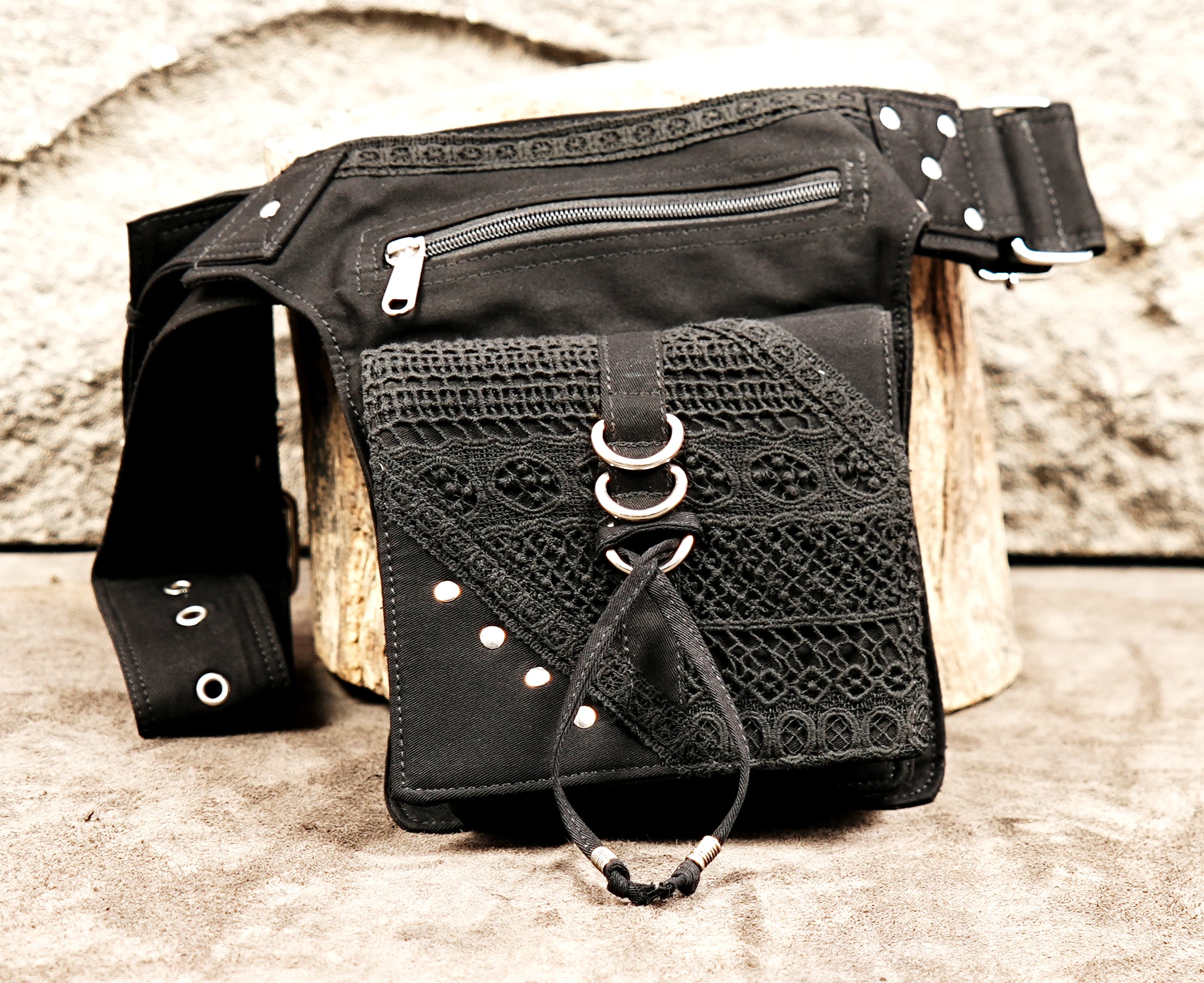 A unique, multi-pocket cotton utility bag perfect for boho-punk and gothic outfits.