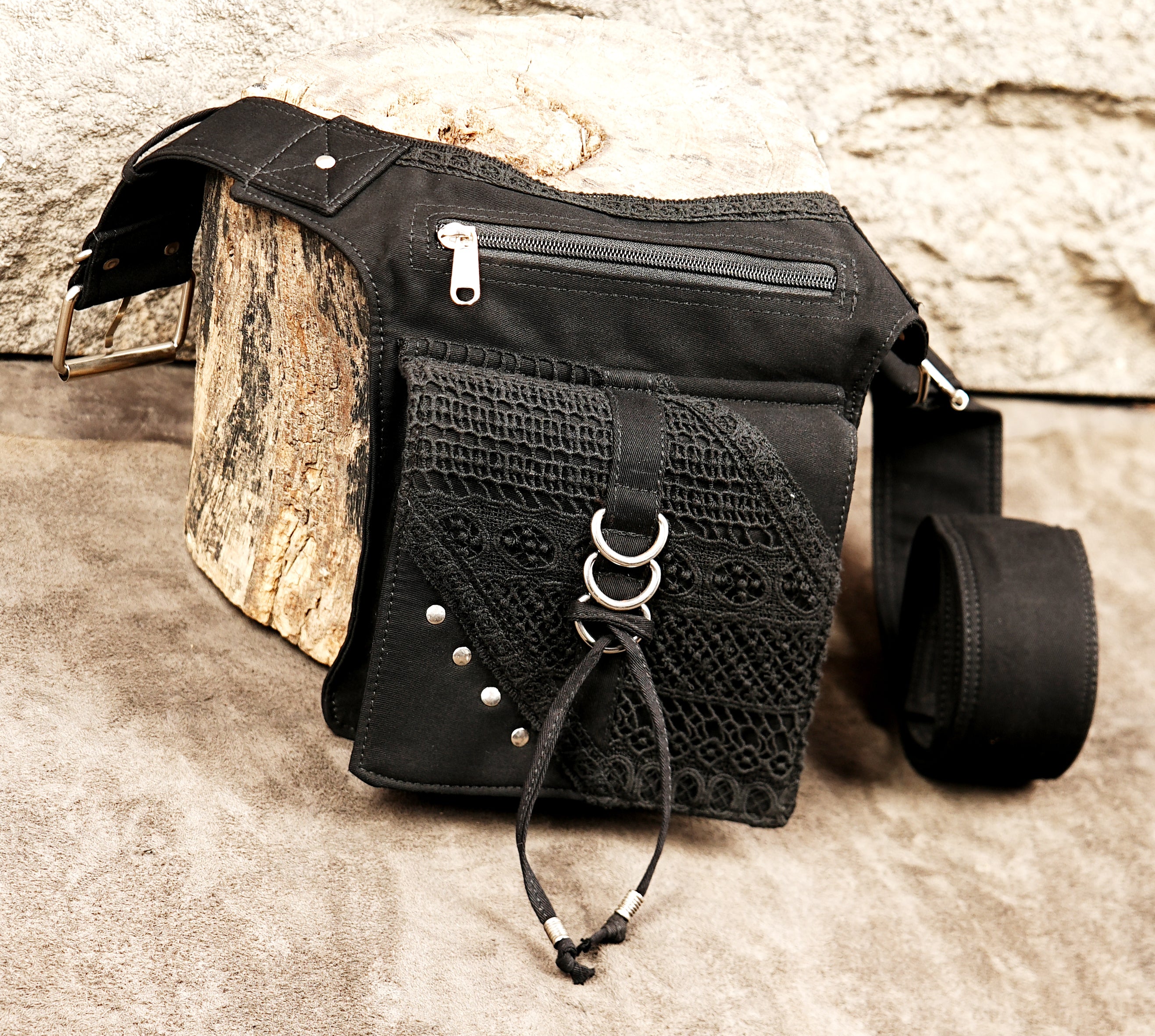 Stylish and secure black fanny pack for keeping essentials safe at large outdoor events or when commuting.
