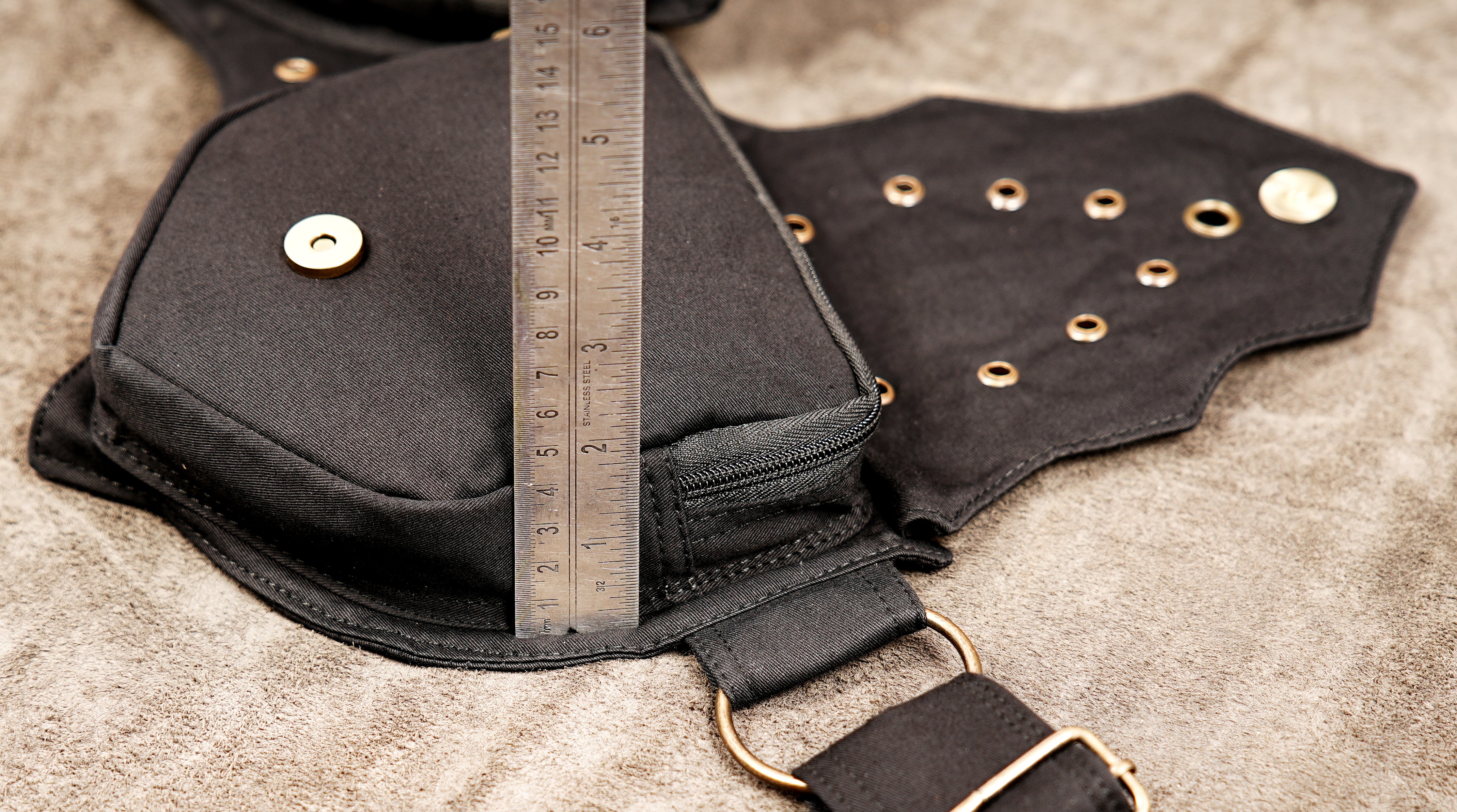 Tribal fusion belt bag with metal grommets and pointed pocket design