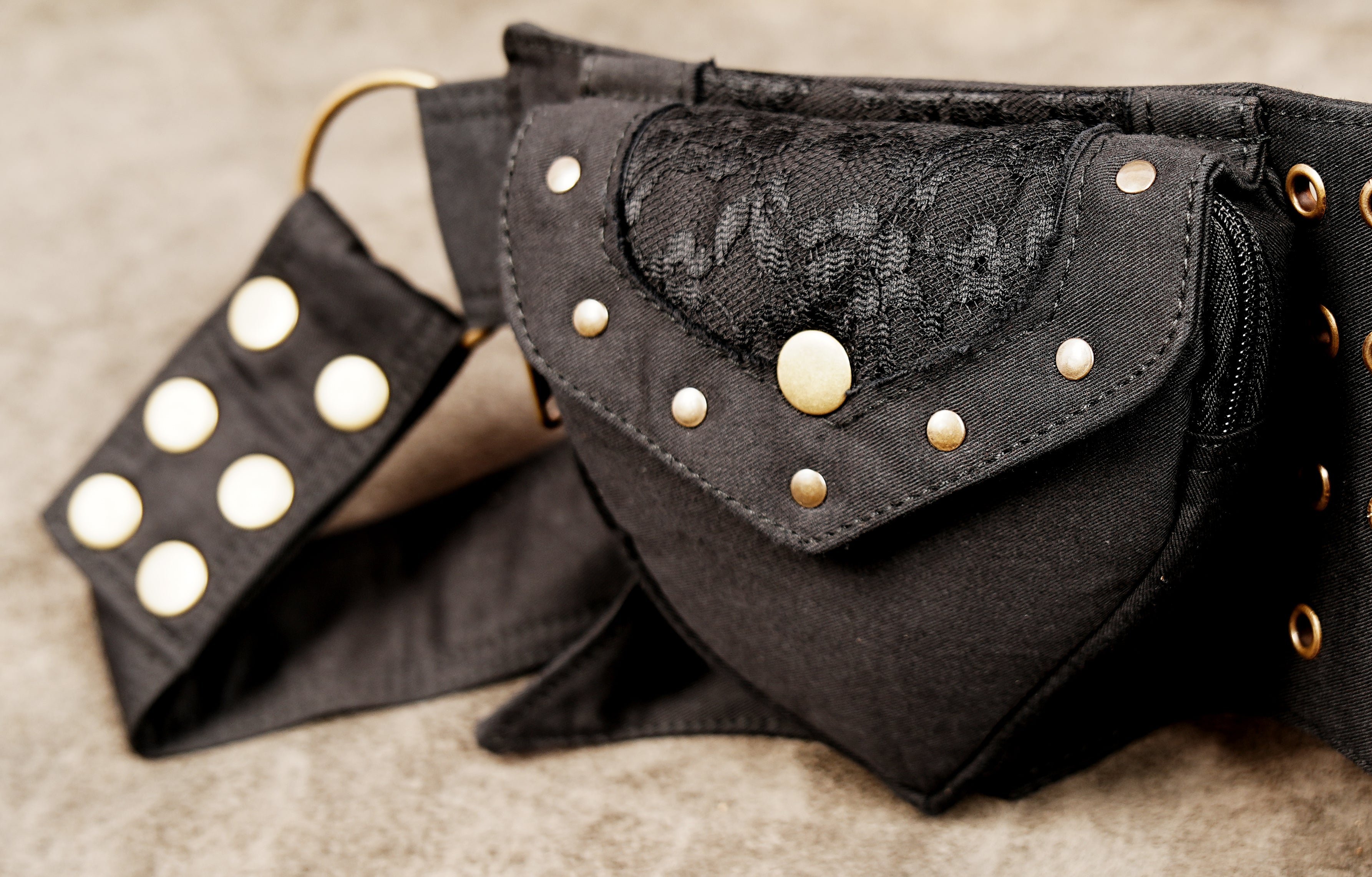 Handmade festival hip bag with secure pockets and eyelet details