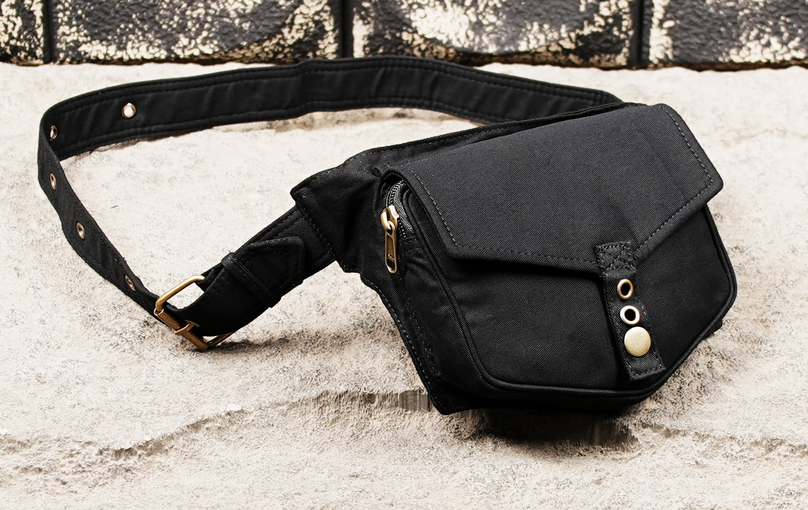 Black canvas hip bag with secure snap closure
