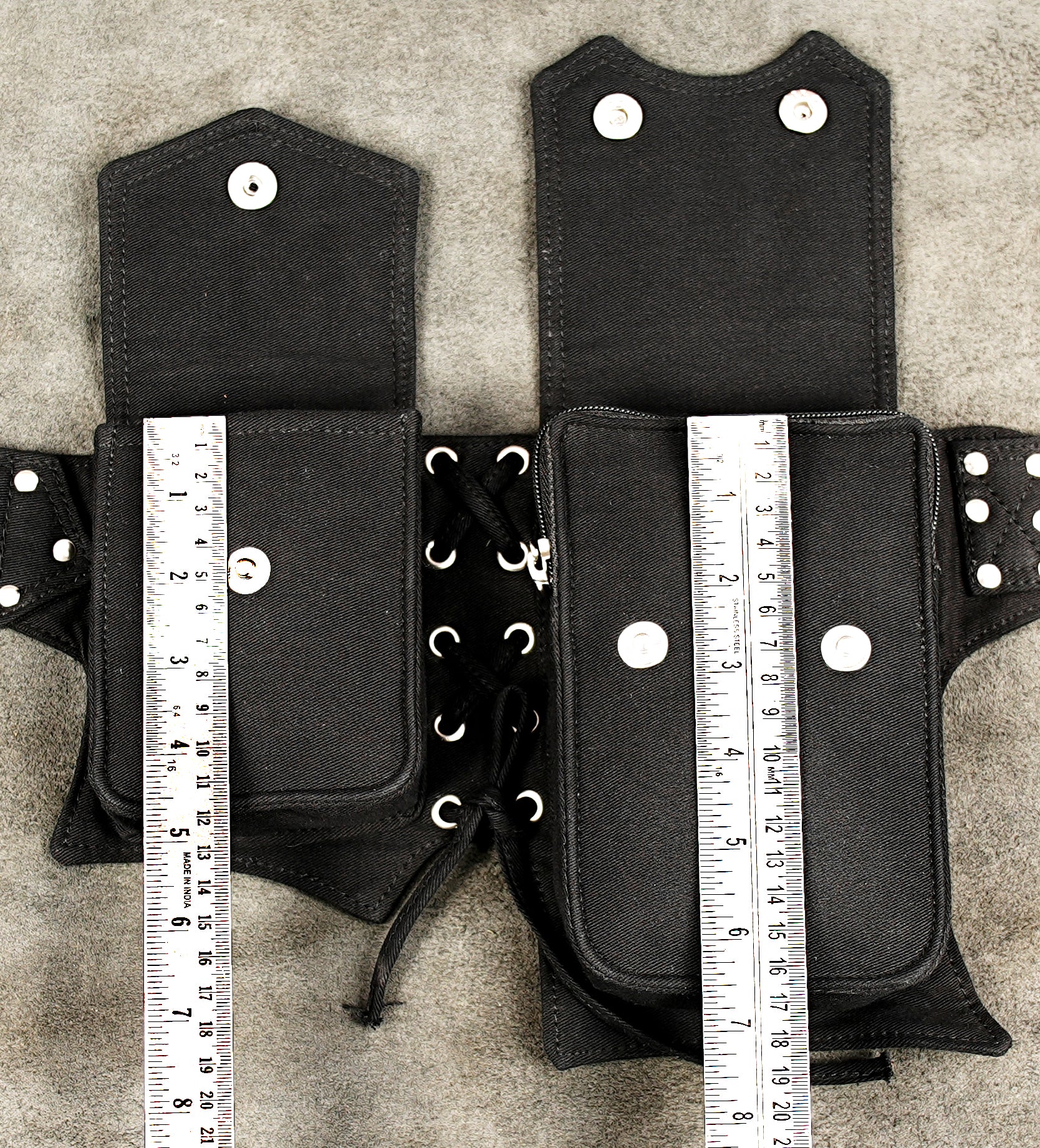 Boho-chic festival belt bag with pockets and metallic stud accents.