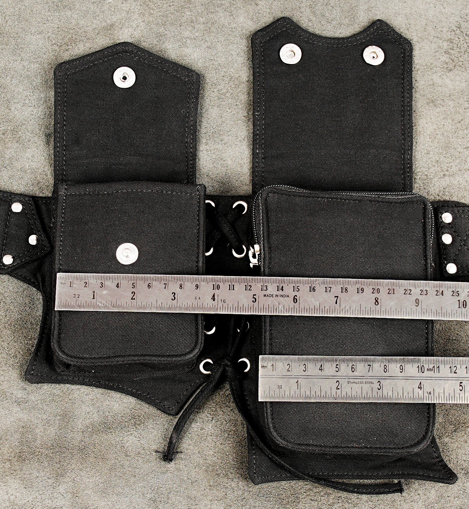 Hands-free travel organizer belt in black canvas with secure pockets for essentials.