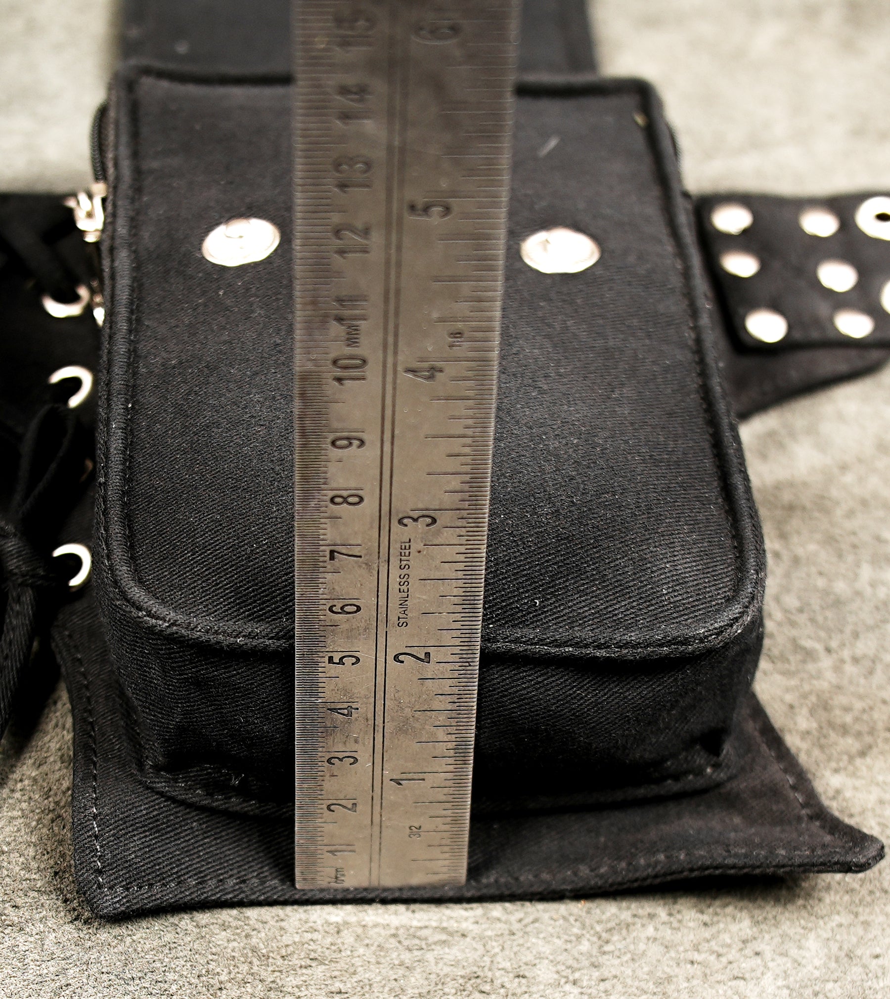Concert and music festival utility belt: black, studded, multi-pocket hip bag.
