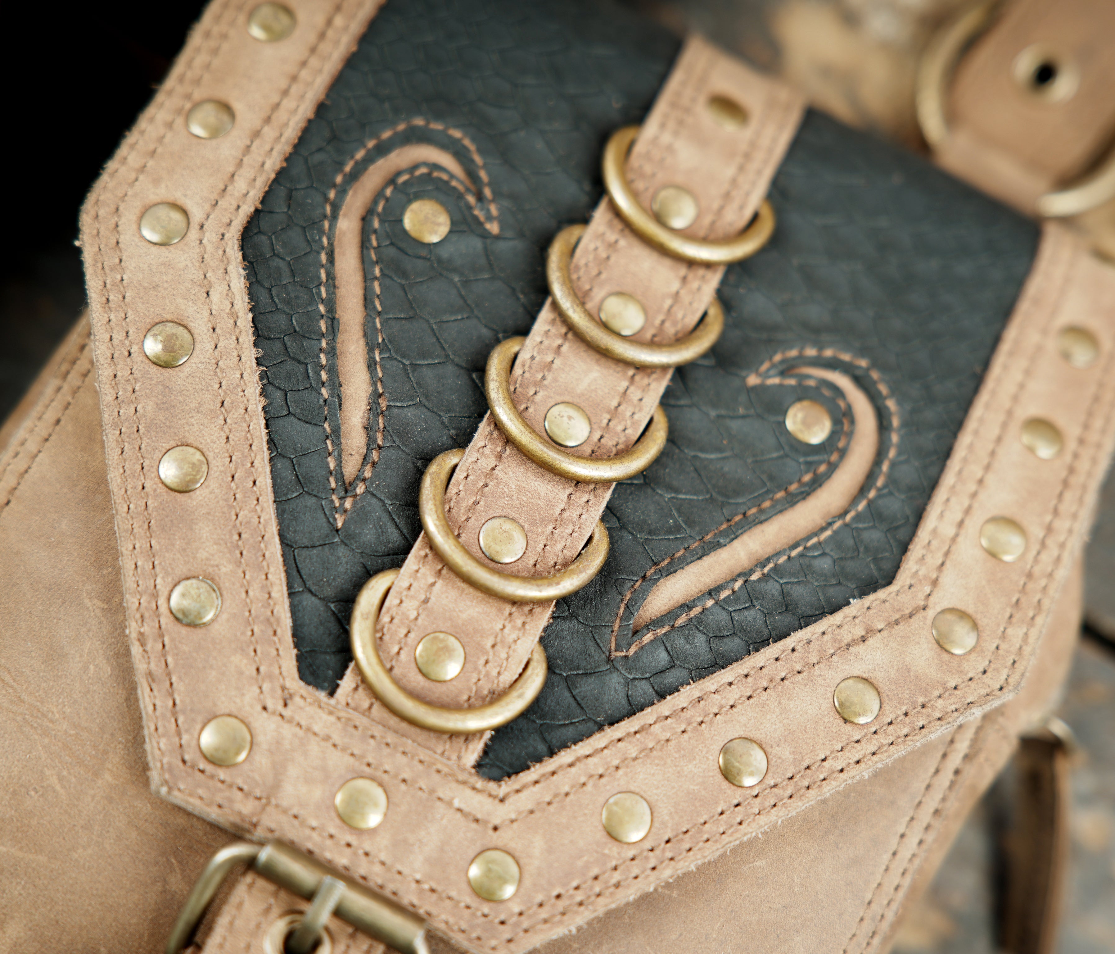 Adjustable leather shoulder holster with dual utility pouches