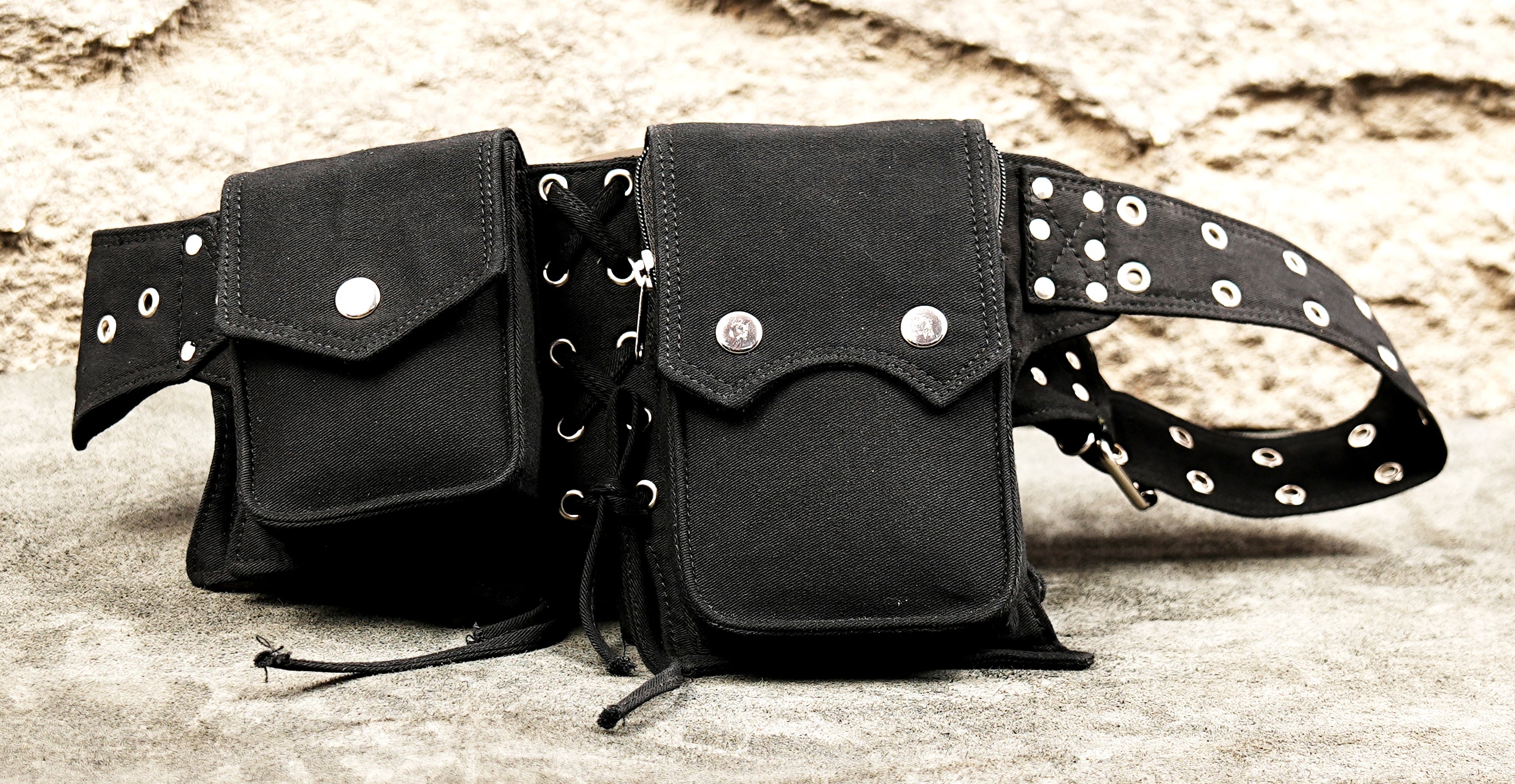Gothic-style black canvas multi-pouch belt with pyramid studs and buckles.